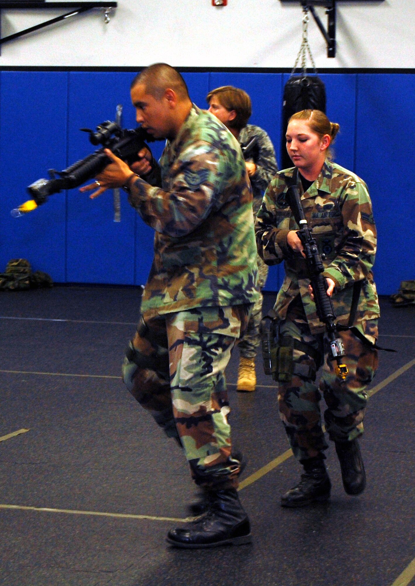 Students in the Air Force Phoenix Warrior Training Course learn close quarters combat tactics during a class session in the U.S. Air Force Expeditionary Center Sept. 22, 2008, on Fort Dix, N.J.  Phoenix Warrior, taught by the center's 421st Combat Training Squadron, is a security forces functional pre-deployment training course focusing on tactics, techniques and procedures unique to the deployed environment.  (U.S. Air Force Photo/Tech. Sgt. Scott T. Sturkol)