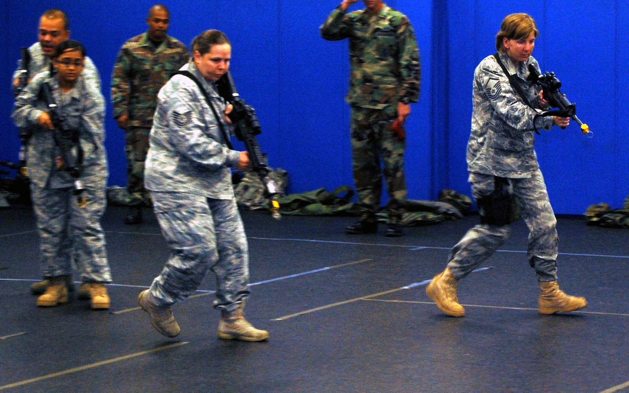Students in the Air Force Phoenix Warrior Training Course learn close quarters combat tactics during a class session in the U.S. Air Force Expeditionary Center Sept. 22, 2008, on Fort Dix, N.J.  Phoenix Warrior, taught by the center's 421st Combat Training Squadron, is a security forces functional pre-deployment training course focusing on tactics, techniques and procedures unique to the deployed environment.  (U.S. Air Force Photo/Tech. Sgt. Scott T. Sturkol)