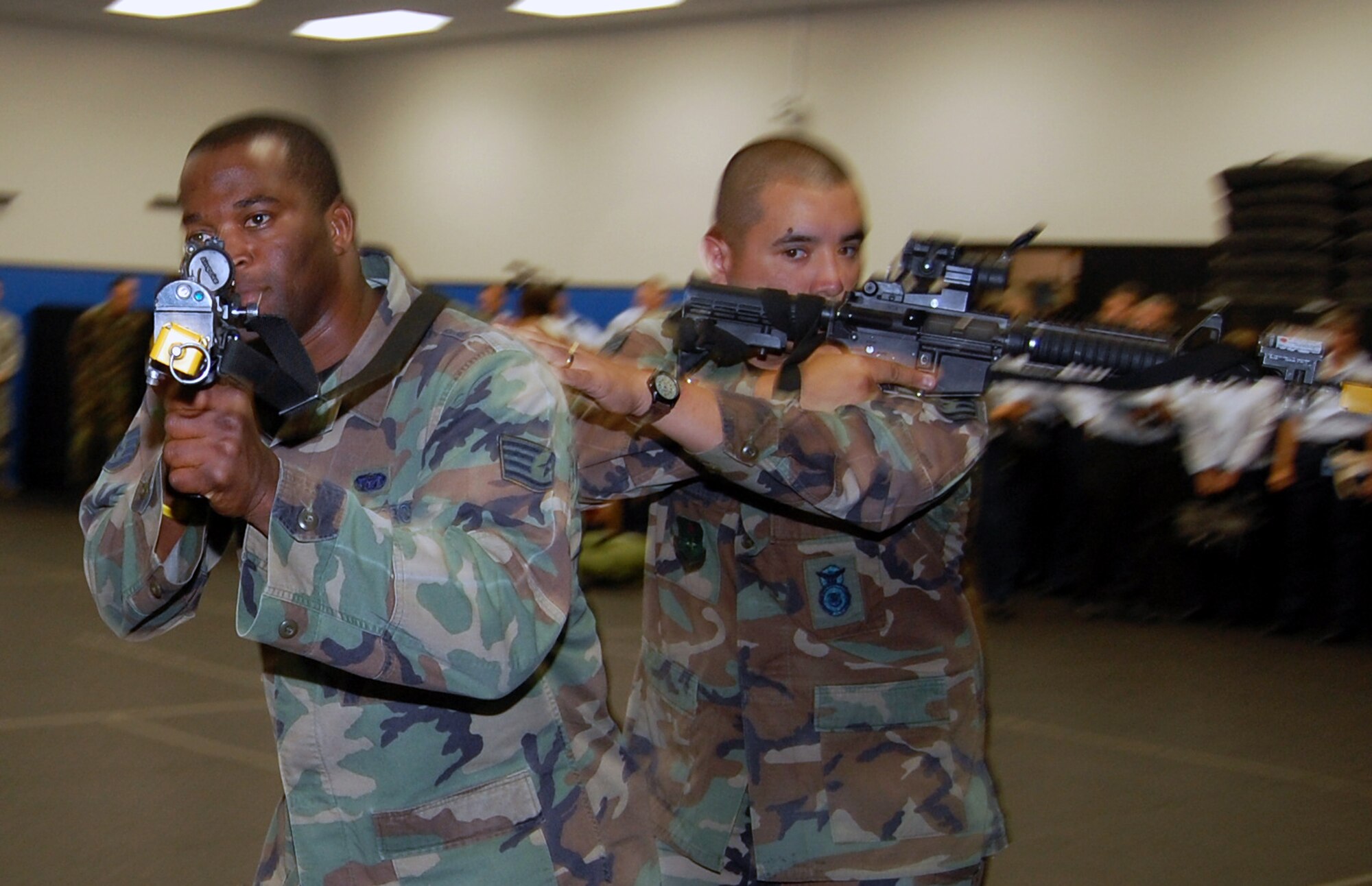 Students in the Air Force Phoenix Warrior Training Course learn close quarters combat tactics during a class session in the U.S. Air Force Expeditionary Center Sept. 22, 2008, on Fort Dix, N.J.  Phoenix Warrior, taught by the center's 421st Combat Training Squadron, is a security forces functional pre-deployment training course focusing on tactics, techniques and procedures unique to the deployed environment.  (U.S. Air Force Photo/Tech. Sgt. Scott T. Sturkol)