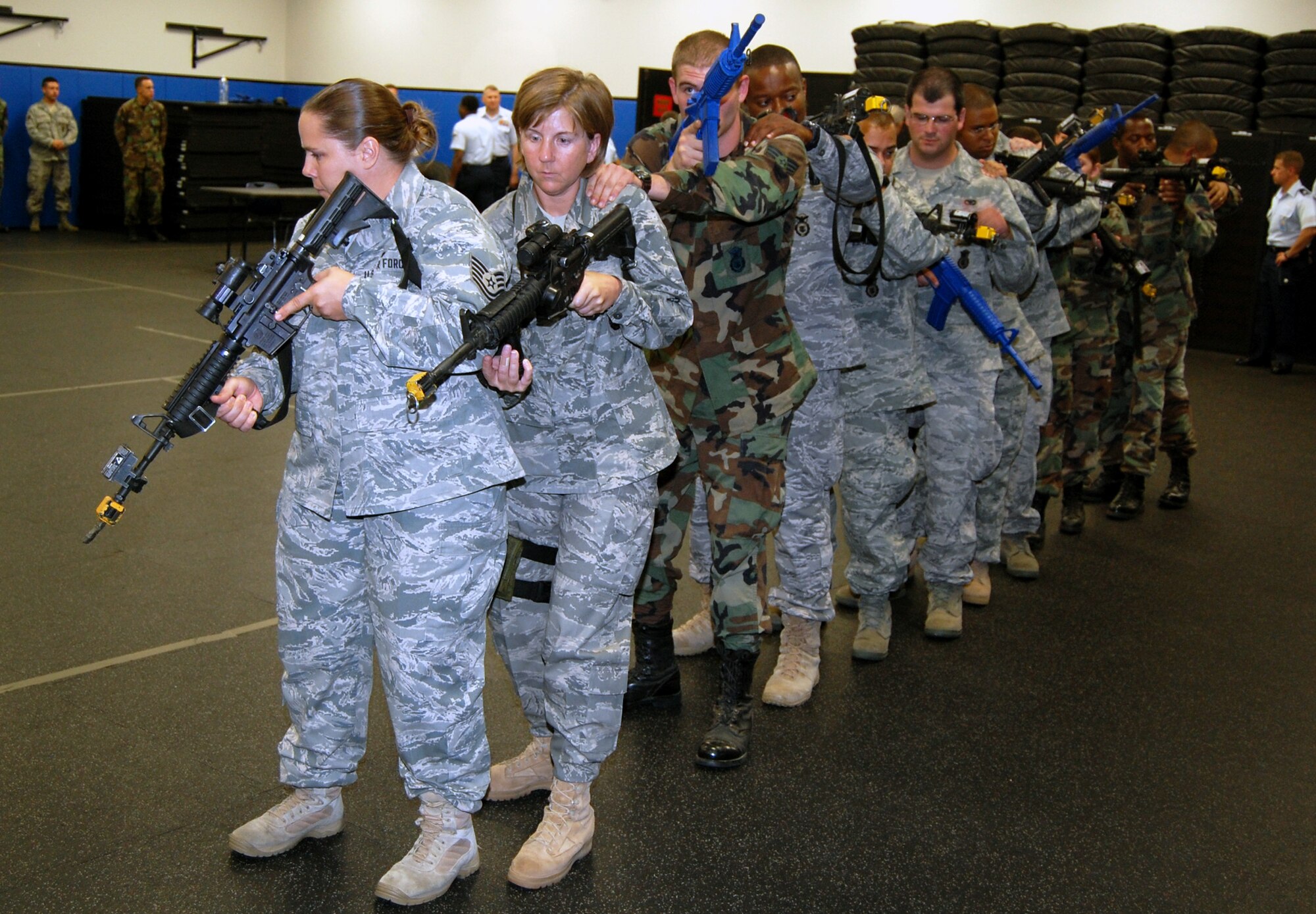 Students in the Air Force Phoenix Warrior Training Course learn close quarters combat tactics during a class session in the U.S. Air Force Expeditionary Center Sept. 22, 2008, on Fort Dix, N.J.  Phoenix Warrior, taught by the center's 421st Combat Training Squadron, is a security forces functional pre-deployment training course focusing on tactics, techniques and procedures unique to the deployed environment.  (U.S. Air Force Photo/Tech. Sgt. Scott T. Sturkol)