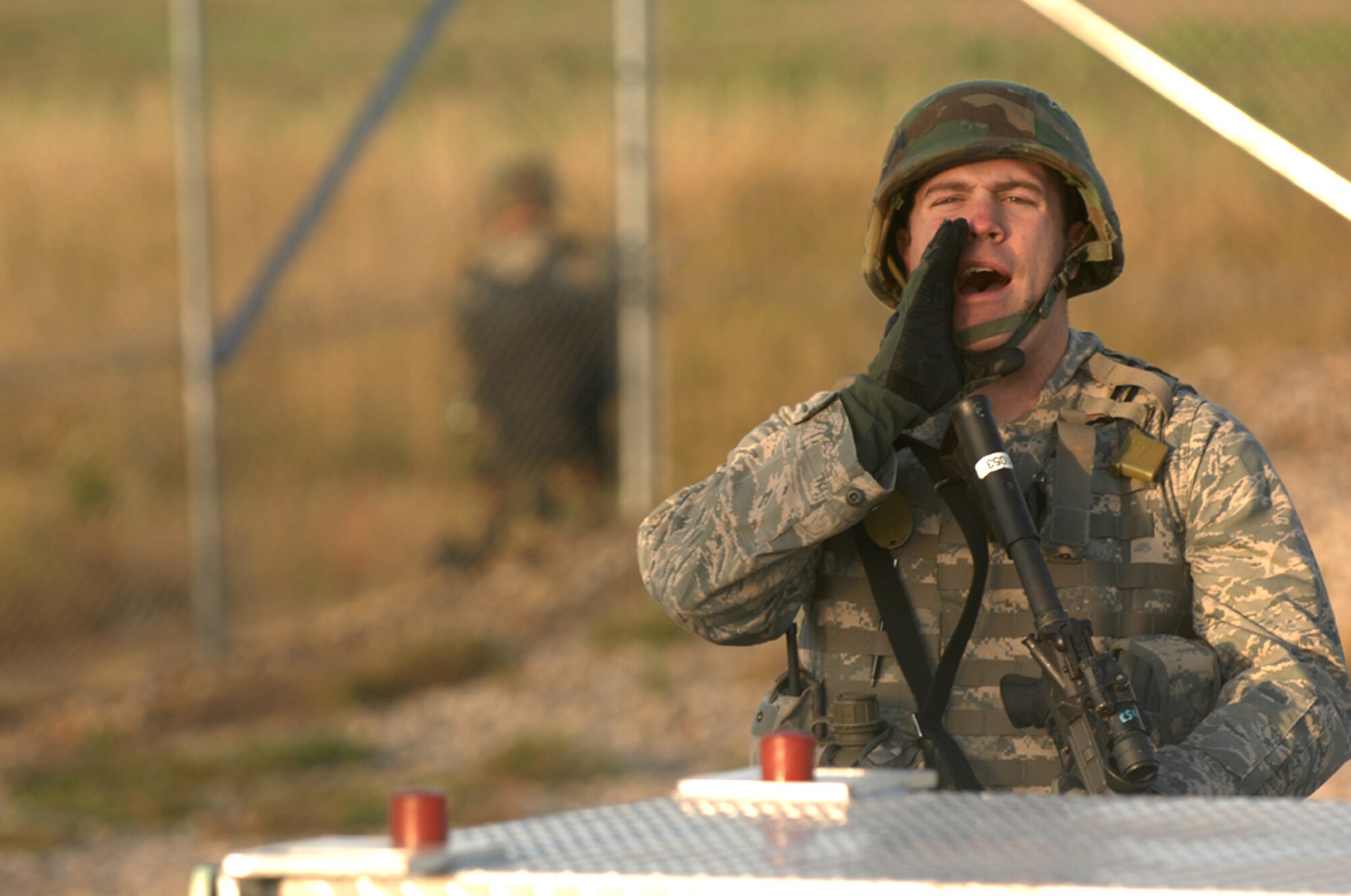 MINOT AIR FORCE BASE, N.D. -- 1st Lt. Jared Brush, 91st Missile Security Forces Squadron, calls out commands during a recapture exercise at a Launch Facility here Sept. 25. The exercise was conducted to test the 91st Security Forces Group’s ability to respond to the invasion of controlled areas. (U.S. Air Force photo by Senior Airman Stacy Moless)