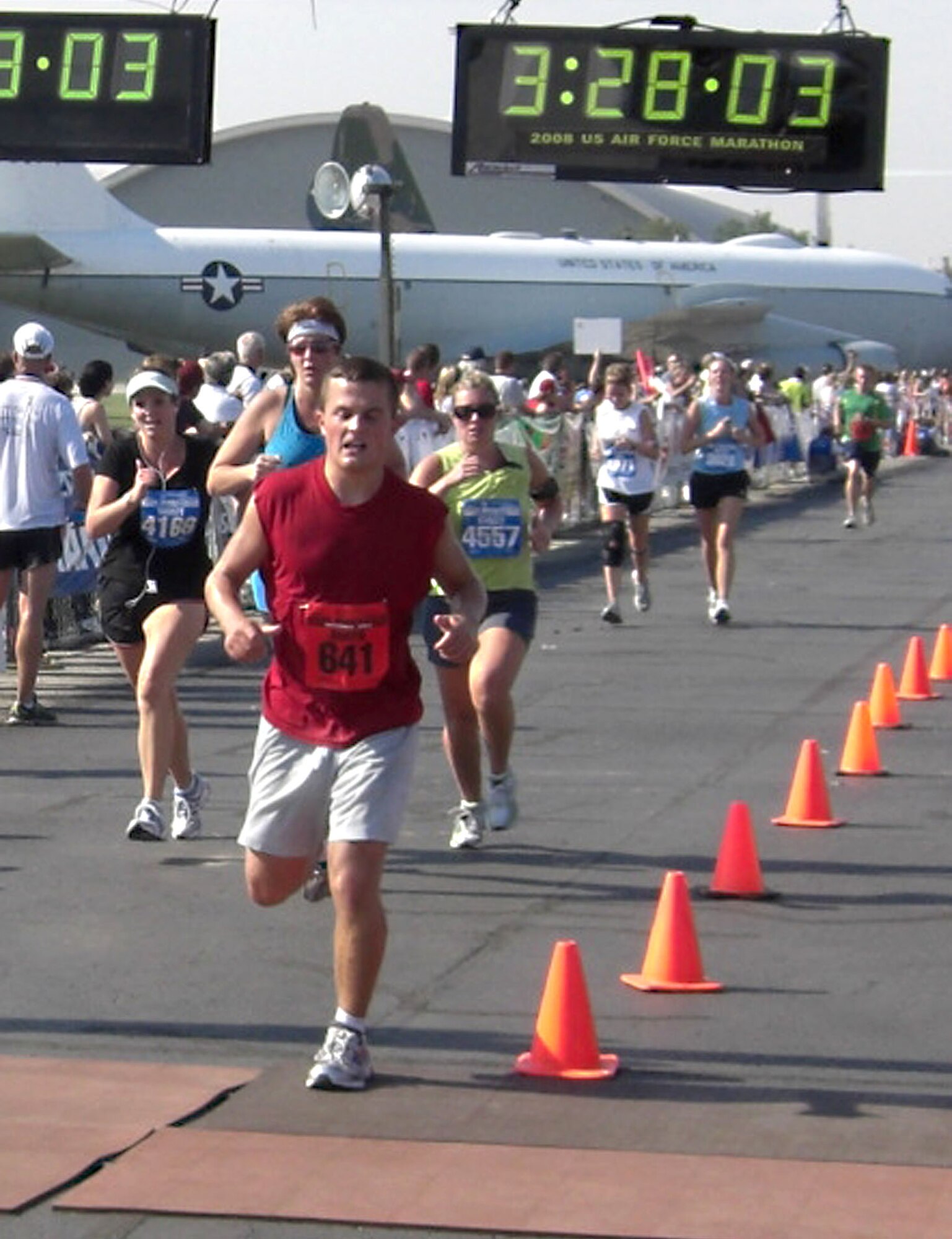 Airman 1st Class Kurt Fisher, 39th Communications Squadron, crosses the finish line at the Air Force Marathon at Wright-Patterson Air Force Base, Ohio, Sept. 20. Airman Fisher was hand picked to be a part of the United States Air Forces in Europe team for the annual marathon. His time was 3:27:53, placing 146 out of 1,798 participant. (U.S. Air Force photo/Maj. Alex Garcia)