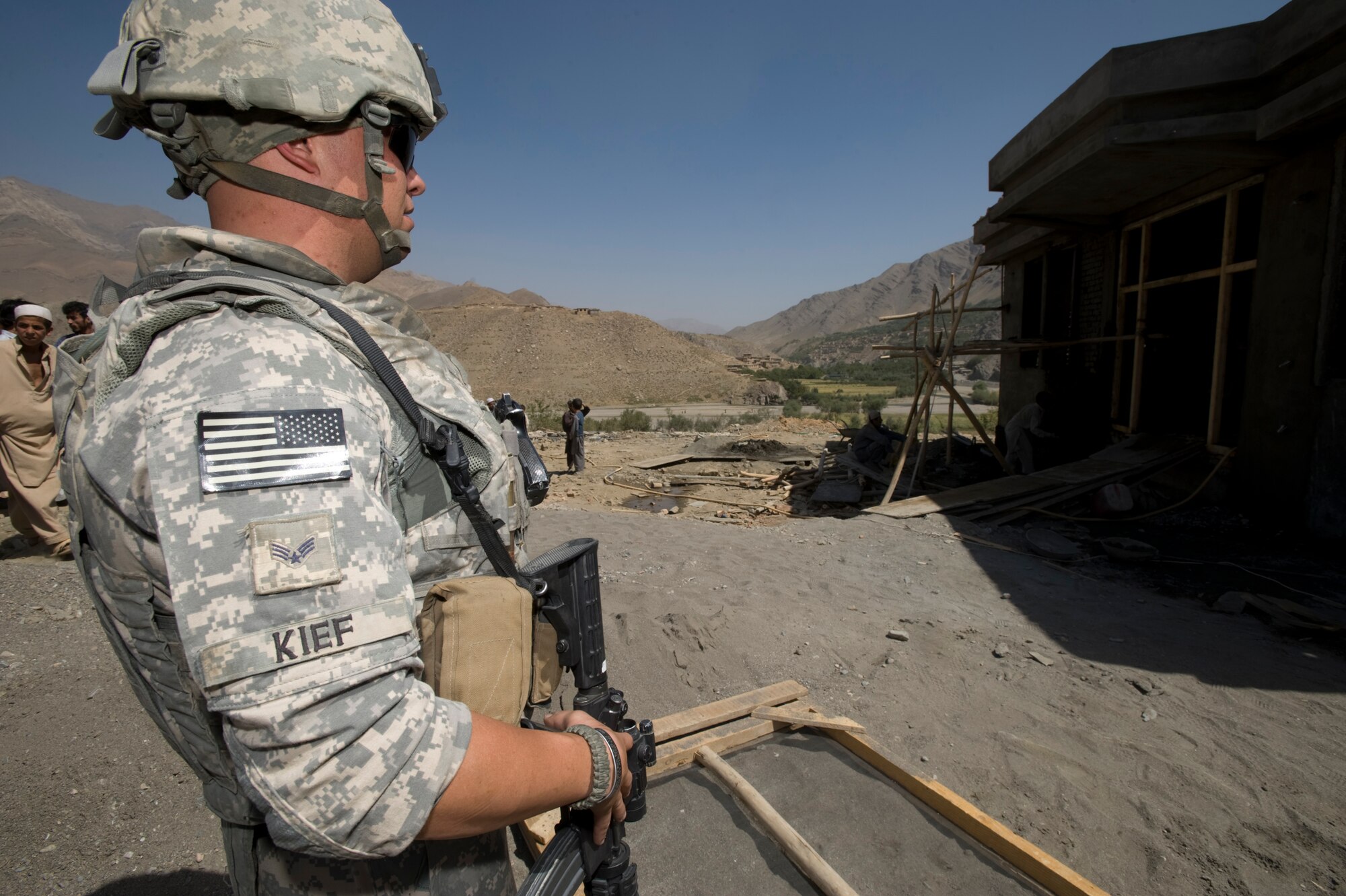 BAGRAM AIR FIELD, Afghanistan – Senior Airman Andrew Kief, a Kapisa and Parwan Provincial Reconstruction Team security forces member, examines progress of construction on a new clinic in a small Afghanistan village recently. Airman Kief served as the convoy commander for this mission and was responsible for coordinating meeting times and setting up the missions agenda. Airman Kief is deployed from 56th Security Forces Squadron at Luke Air Force Base, Ariz. (U.S. Air Force photo/Master Sgt. Keith Brown)