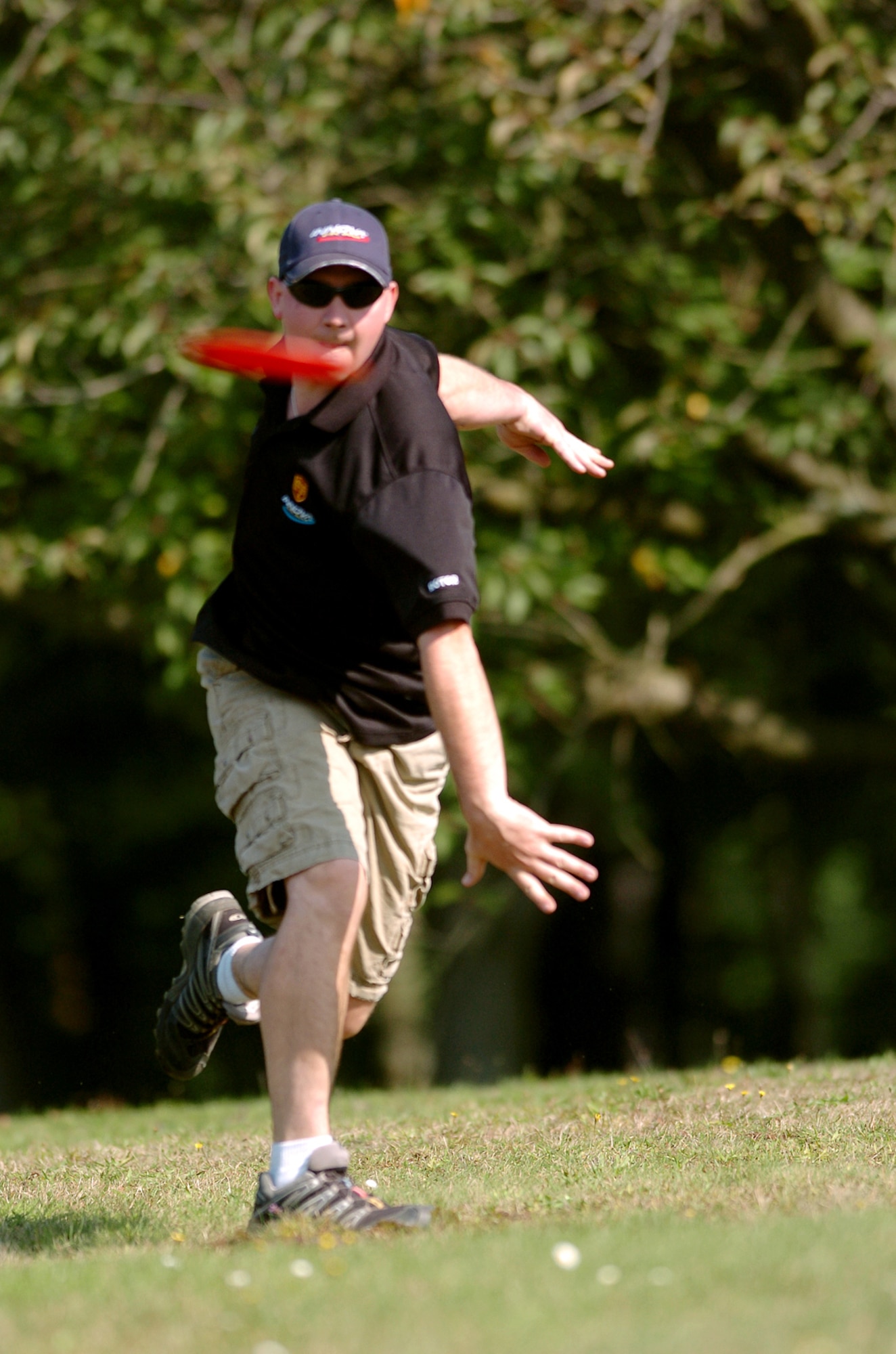 United States Staff Sgt. Geoffrey McReynolds, 721st Aircraft Maintenance Squadron crew chief, hurls a practice drive with a wraith driver disc, which is specially made for long throws. Sergeant McReynolds is currently ranked the number one disc golf pro in Germany, number two in Europe, and 158th in the world. (U.S. Air Force photo by Capt. John Ross)(Released)