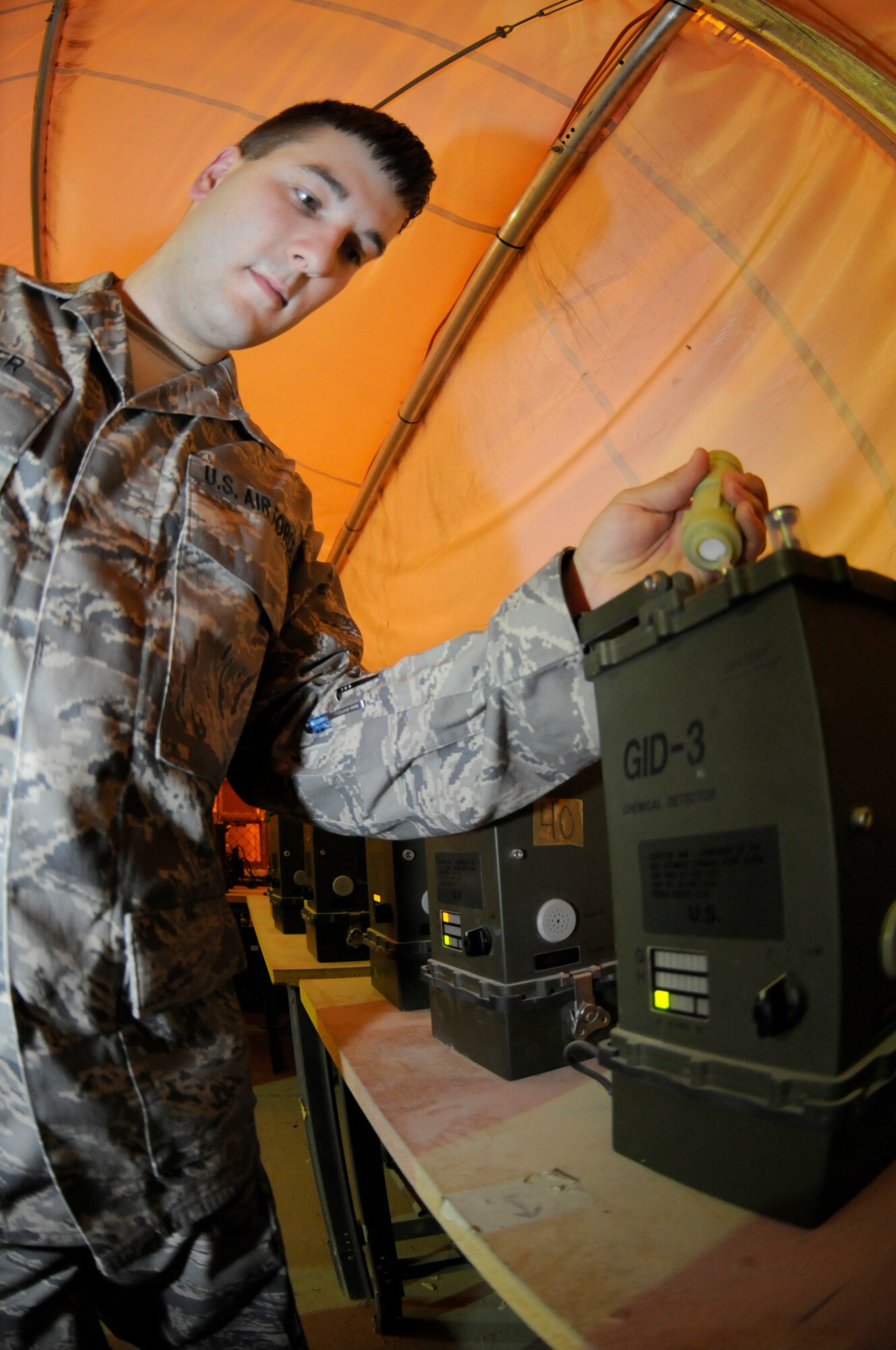 Airman 1st Class James Baker, emergency management journeyman assigned to the 379th Expeditionary Civil Engineer Squadron, uses a stimulant to do an operational check on M-22 chemical detectors Oct. 1, 2008, at an undisclosed air base in Southwest Asia. Emergency management members ensure equipment and personnel are prepared should the enemy choose to resort to chemical weapons use. Airman Baker, a native of Stafford, Va., is deployed from Yokota Air Base, Japan, in support of Operations Iraqi and Enduring Freedom and Joint Task Force-Horn of Africa. (U.S. Air Force photo by Staff Sgt. Darnell T. Cannady/Released)