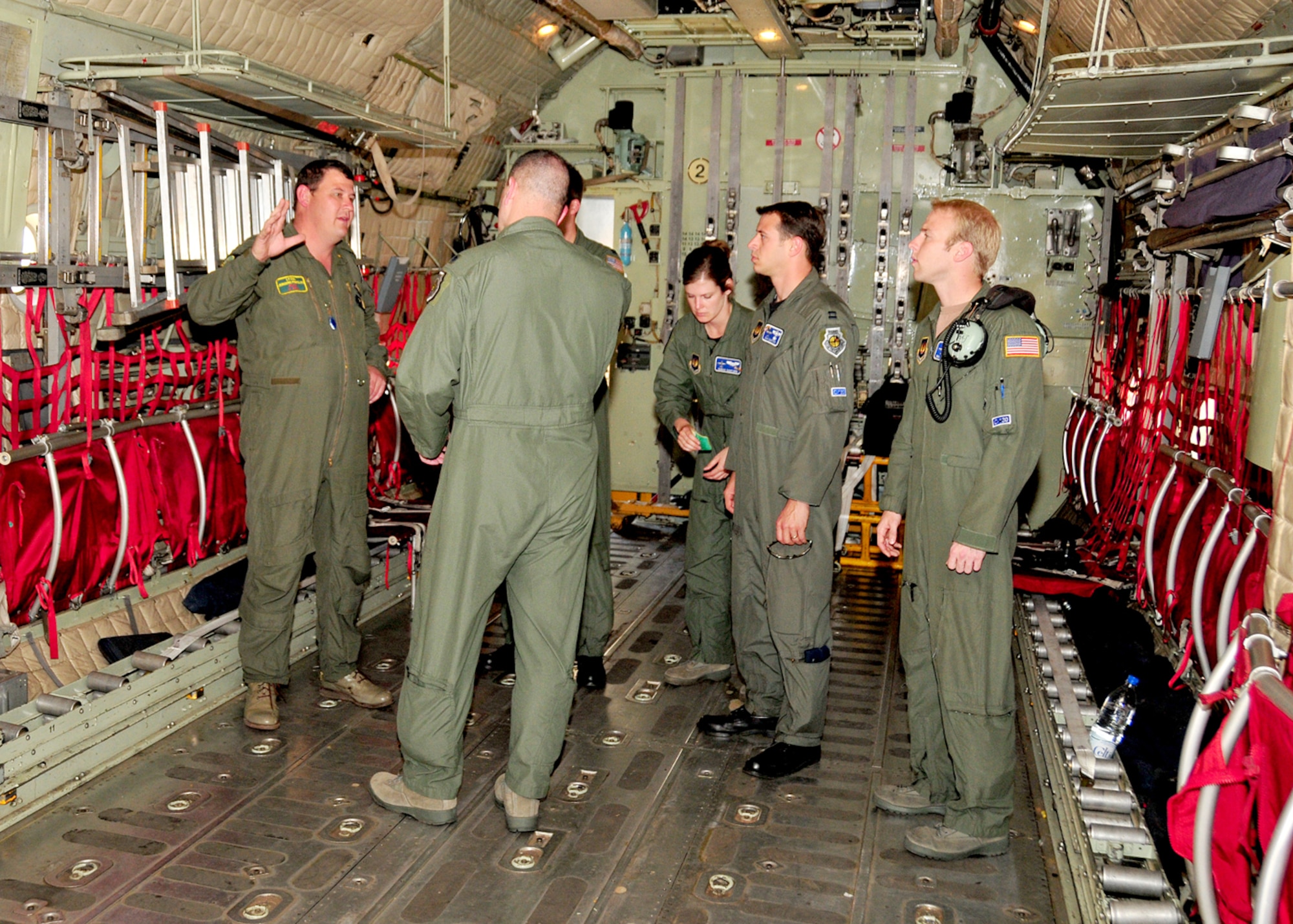 Lieutenant Col. Jurgens Prinsloo, 28th Squadron C-130 pilot, South Africa National Defense Force, gives U.S. Air Force air crew members from the 37th Airlift Squadron, Ramstein Air Base, Germany, a tour of a South African Air Force C-130, Ysterplaat Air Force Base, South Africa, Sept. 22, 2008. (U.S. Air Force photo by Staff Sgt. Markus Maier)(Release)
