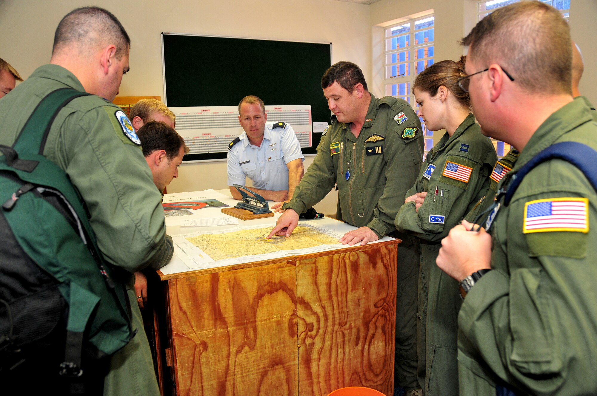 Lieutenant Col. Jurgens Prinsloo, 28th Squadron C-130 pilot, South Africa National Defense Force, gives a preflight briefing to U.S. Air Force air crew members from Ramstein Air Base, Germany, before taking them on a familiarization flight on one of the South African Air Force C-130s, Ysterplaat Air Force Base, South Africa, Sept. 22, 2008. (U.S. Air Force photo by Staff Sgt. Markus Maier)(Release)