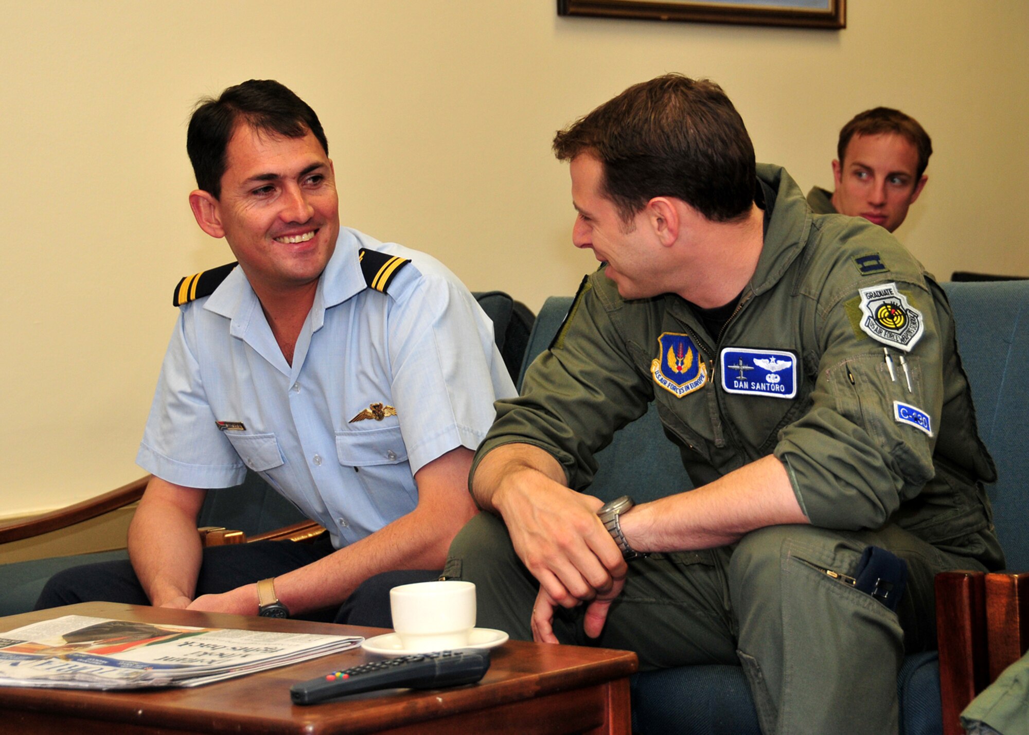 United States Air Force Capt. Dan Santoro, 37th Airlift Squadron C-130 pilot, Ramstein Air Base, Germany, shares some thoughts with one of his South African Air Force counter parts, Ysterplaat Air Force Base, South Africa, Sept. 22, 2008. (U.S. Air Force photo by Staff Sgt. Markus Maier)(Release)