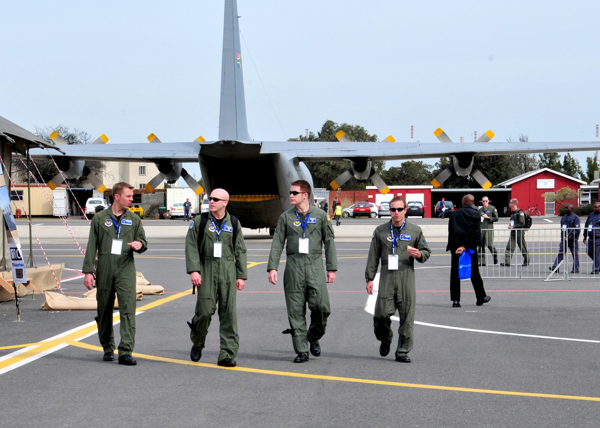 United States Air Force Captains Trevor Gunderson, John Anthes, Aaron Justice copilot and Luke Vitolo, all from the 37th Airlift Squadron, Ramstein Air Base, Germany, walk around at the 2008 Africa Aerospace & Defense Air Show, Ysterplaat Air Force Base, South Africa, Sept. 17, 2008. (U.S. Air Force photo by Staff Sgt. Markus Maier)(Release)