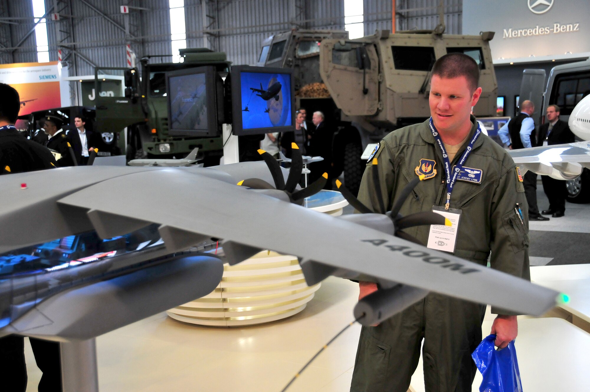 United States Air Force Staff Sgt. Jeremy Lynn, .37th Airlift Squadron C-130 flight engineer, Ramstein Air Base, Germany, looks at a model of the Airbus A-400 at the 2008 Africa Aerospace & Defense Air Show, Ysterplaat Air Force Base, South Africa, Sept. 17, 2008. (U.S. Air Force photo by Staff Sgt. Markus Maier)(Release)