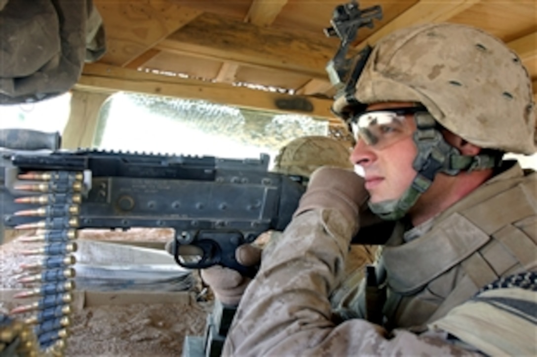 U.S. Marine Corps Lance Cpl. Alexander Monaghan provides security at Camp Caffereta, Afghanistan, Sept. 27, 2008. Monaghan is a designated marksman assigned to the 1st Platoon, 2nd Squad, Fox Company, 2nd Battalion, 7th Marine Regiment. 