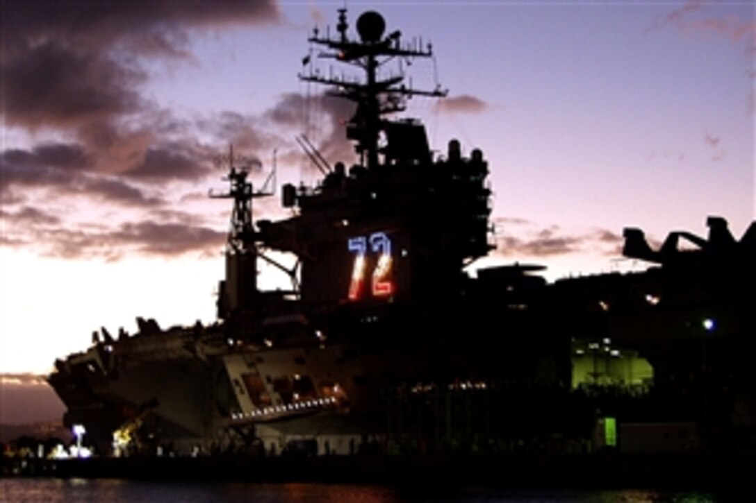 The aircraft carrier USS Abraham Lincoln is moored at Naval Station Pearl Harbor for a brief port visit before completing a seven-month deployment supporting maritime security operations and theater security cooperation in the U.S. 5th and 7th Fleet areas of responsibility, Pearl Harbor, Sept. 30, 2008. The USS Abraham Lincoln also participated in action supporting operations Iraqi Freedom and Enduring Freedom. 