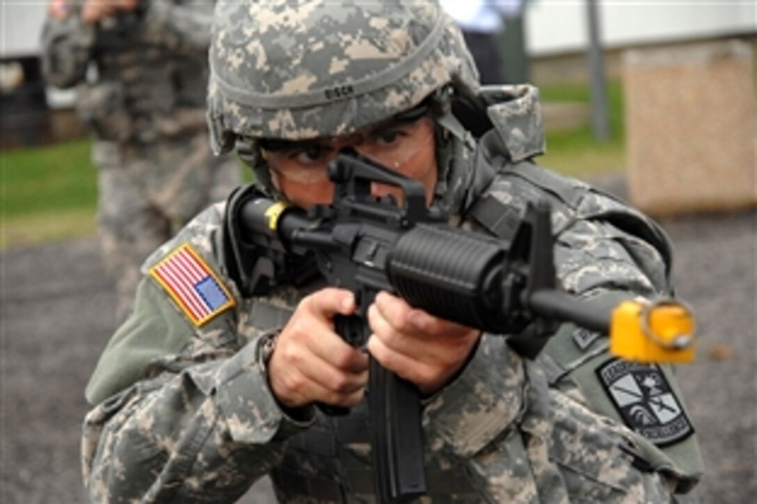 U.S. Army Sgt. 1st Class Brian Eisch takes a stance during reflexive fire training, Sept. 30, 2008. Eisch is one of 24 soldiers competing in the 2008 Department of the Army Noncommissioned Officer and Soldier of the Year “Best Warrior” Competition, Sept. 28 to Oct.6, 2008, at Fort Lee, Va. Eisch is assigned to the U.S. Army Training and Doctrine Command.