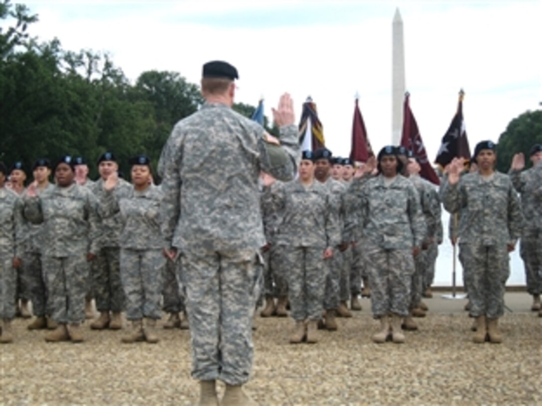 A group of 80 soldier-medics, whose duties adhere to the Hippocratic Oath to provide ethical medical treatment, pledged allegiance to another credo -- the oath of re-enlistment during an Oct. 2, 2008,  ceremony between the reflecting pool and the Lincoln Memorial in Washington, D.C. The oath was administered by Lt. Gen. (Dr.) Eric B. Schoomaker, Army surgeon general. 