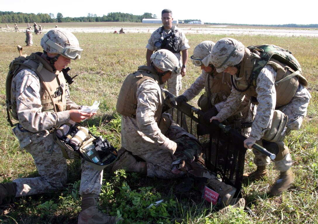 Marines and sailors from Combat Logistics Battalion 22, 22nd Marine Expeditionary Unit, load role players onto a stretcher during a massive casualty exercise Oct 2, 2008, aboard Fort Pickett, Va., a Virginia Army National Guard Maneuver Training Center. The exercise was part of the CLB's off-site training, the first major evolution of the 22nd MEU's six-month pre-deployment training cycle. The 22nd MEU is scheduled to deploy early next year. (Official Marine Corps photo by Staff Sgt. Matt Epright)::r::::n::