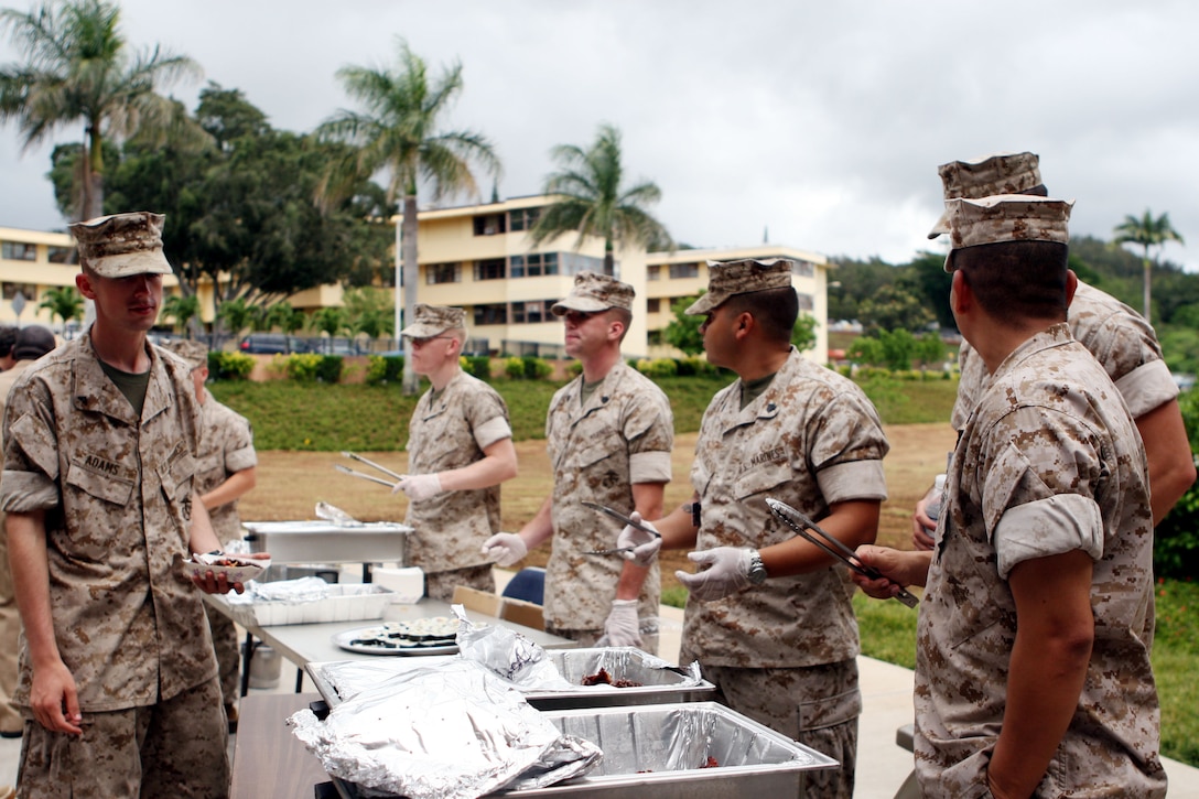 Marines from Headquarters and Service Battalion serve up lunch for attendees at the Hawaii - Pacific Area Combined Federal Campaign kickoff in front of the U.S. Pacific Command Building Oct. 3.