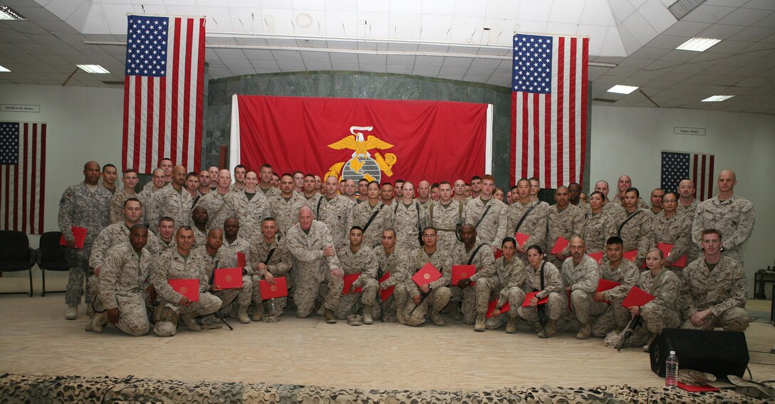 CAMP FALLUJAH, Iraq -- The graduating class of I Marine Expeditionary Force Headquarters Group (Forward)'s martial arts instructor course poses together Oct. 3 after the graduation ceremony inside Camp Fallujah's Chapel of Hope.  This martial arts instructor course had the most graduates of any Marine Corps Martial Art Program's MAI classes.  (Photo by Cpl. Sean P. McGinty)