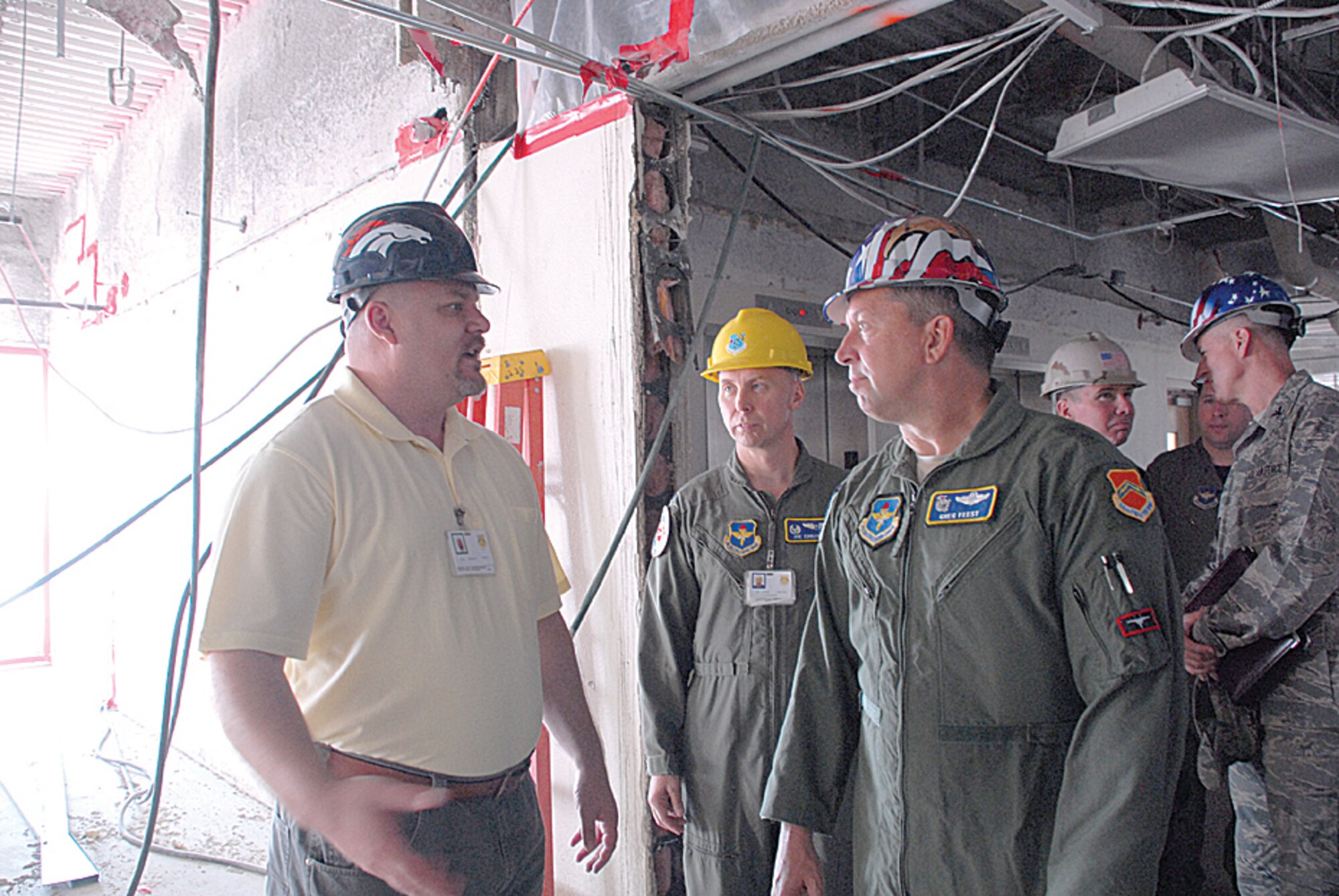 Michael Perna, 56th Medical Group facility manager, explains the remodeling plans to Maj. Gen. Feest, 19th Air Force commander, during his visit to Luke Sept. 26. (U.S. Air Force Photo/Airman 1st Class Tracie Forte.)