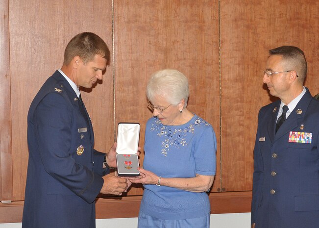Col. Keith Gentile, 9th Reconnaissance Wing vice commander, presents Rosemary Brown, wife of Chief Master Sgt. (Ret.) Robert Brown, with the Bronze Star Award at Beale's 9th RW headquarters Sept. 30. Chief Brown was unable to attend the award ceremony due to illness. He is the youngest remaining survivor of the Bataan Death March, which began after  more than 72,000 American and Filipino soldiers surrendered to Japanese forces on the island of Bataan in the Philippines on April 9, 1942. (Photo by John Schwab)