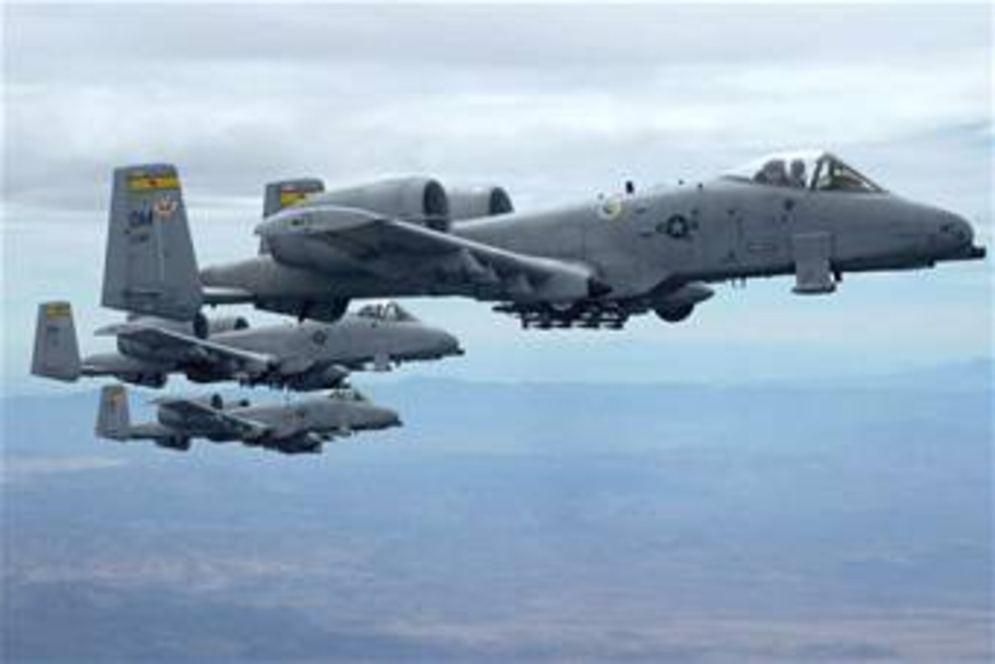 Three A-10 Thunderbolt IIs fly in formation. A-10s provided close-air-support near Balad, Iraq. Air Force officials have called for an immediate inspection and repair of wing cracks for a portion of the A-10 Thunderbolt II fleet.(U.S. Air Force photo/Senior Airman Christina D. Ponte)