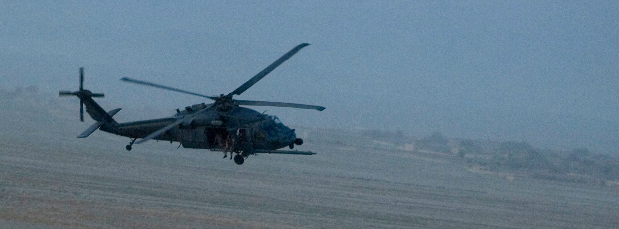 An HH-60G Pave Hawk conducts combat search and rescue training mission Sept. 25 near Bagram Air Field, Afghanistan. The training mission was conducted with support from the Army's AH-64 Apaches in an effort to integrate operations in high-threat environments. (U.S. Air Force photo/Staff Sgt. Rachel Martinez) 
