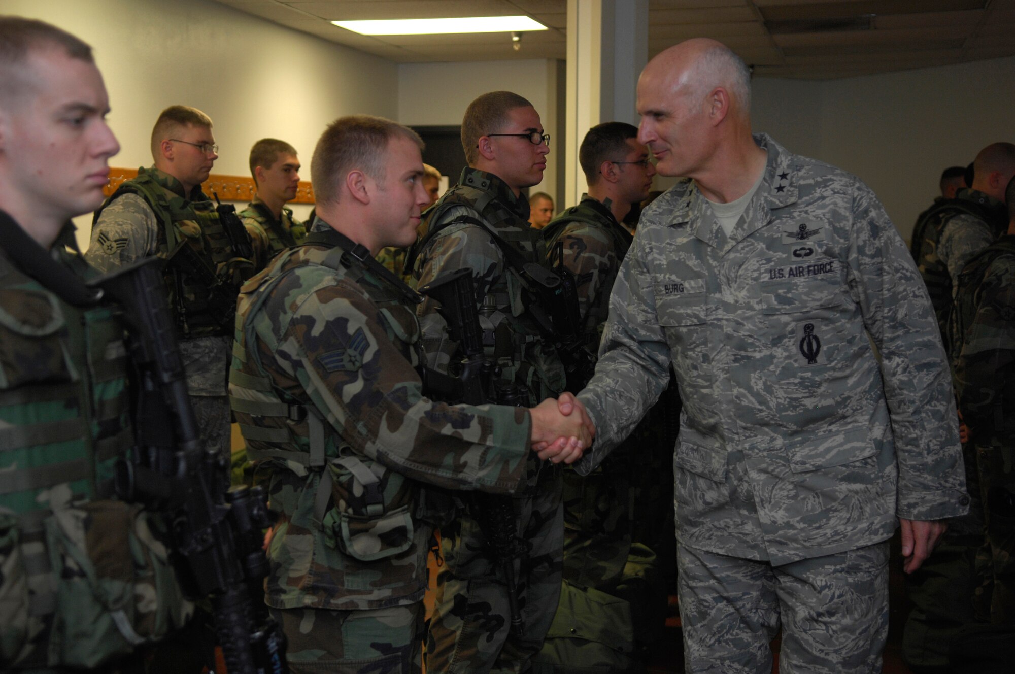 MINOT AIR FORCE BASE, N.D. -- Major General Roger Burg, 20th Air Force Commander, shakes hands and gives his thanks to the Airmen from the 91st Missile Security Forces Squadron here, Oct. 2. General Burg stated that he is proud of them and wants them to keep up the great work towards security in the missile fields. (U.S. Air Force photo by Senior Airman Joe Rivera)