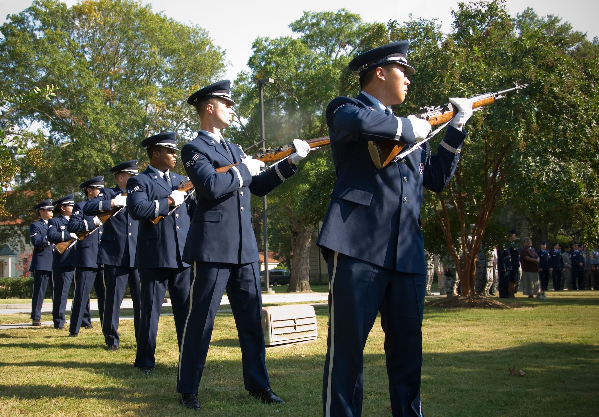 Members of the Maxwell-Gunter Honor Guard provide a 21-gun salute outside of Chapel 2 Tuesday at the memorial for fallen 42nd Security Forces Squadron member Senior Airman Samantha Sculthorpe, who died Sept. 25 in an automobile accident. (Air Force photo by Melanie Rodgers)