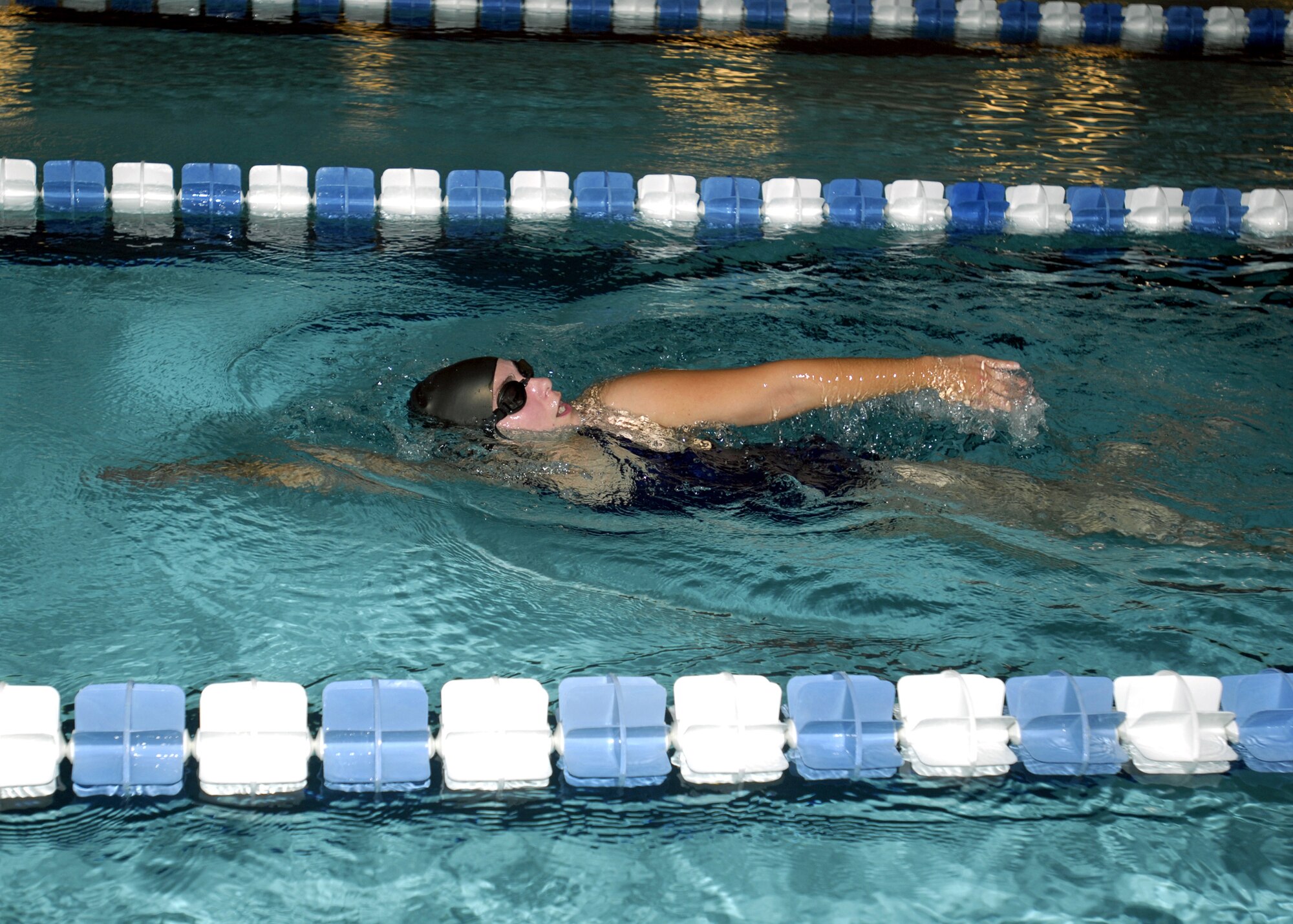 MINOT AIR FORCE BASE, N.D. — Katy Peterson swims laps in the indoor pool located at the McAdoo Sports and Fitness Center here Oct. 1. The fitness center’s indoor pool is available for open swimming reservations by individuals, groups, or squadrons. (U.S. Air Force photo by Airman 1st Class Jesse Lopez)