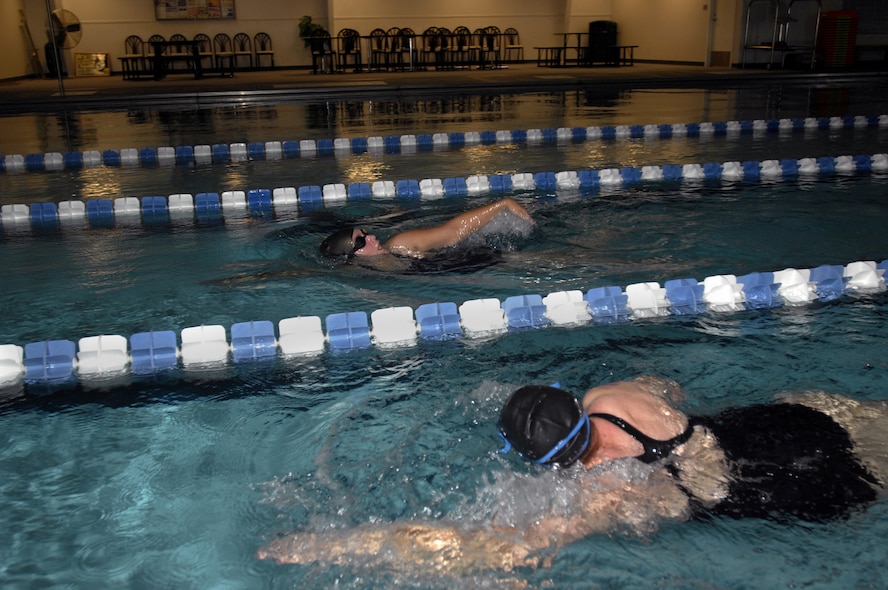 MINOT AIR FORCE BASE, N.D. — Katy Peterson and Susan Peterson swim laps as part of their weekly workout in the indoor pool located at the McAdoo Sports and Fitness Center here at Oct. 1. The fitness center’s indoor pool is available for open swimming reservations by individuals, groups, or squadrons. (U.S. Air Force photo by Airman 1st Class Jesse Lopez)