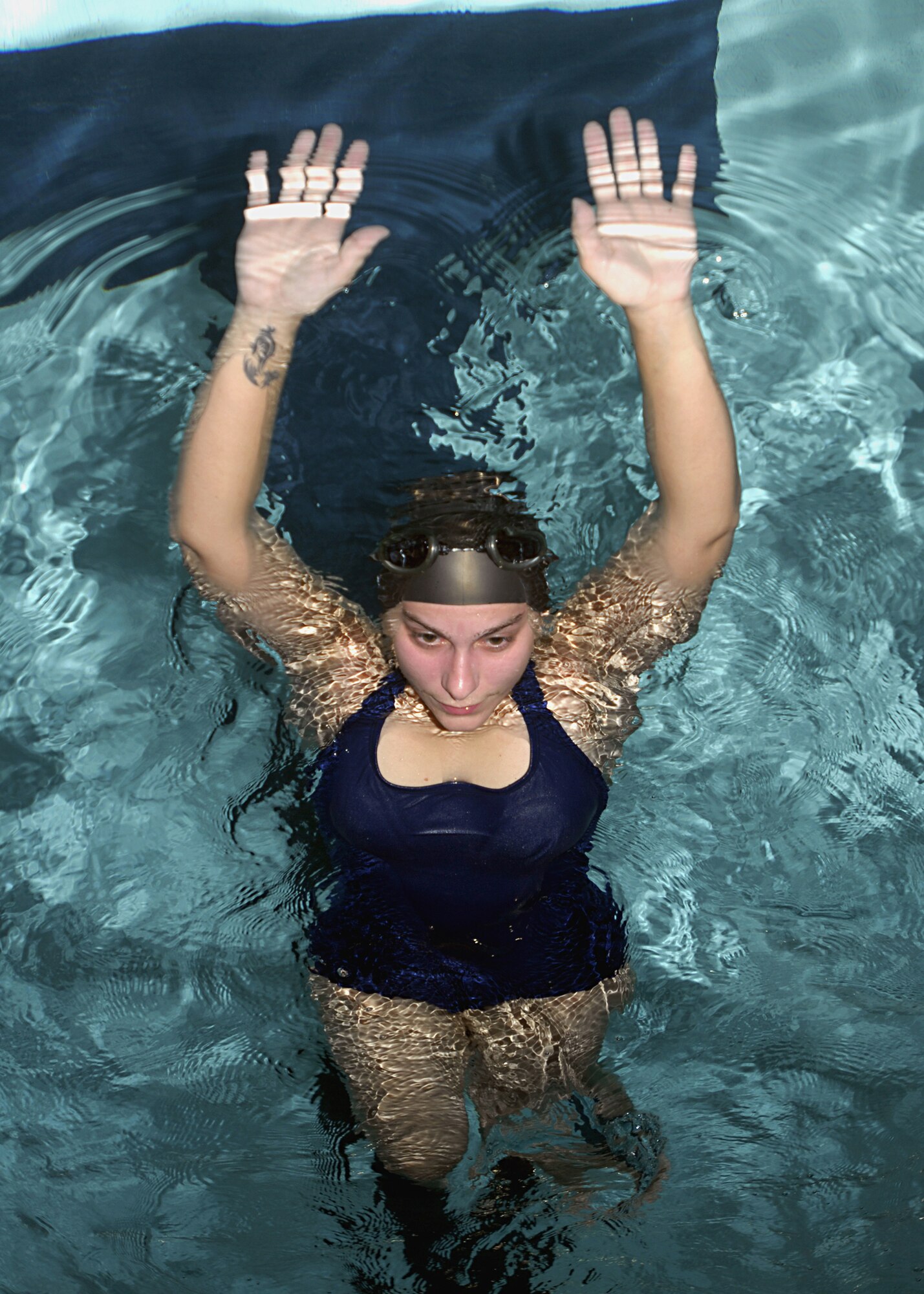 MINOT AIR FORCE BASE, N.D. — Katy Peterson practices swim strokes in the indoor pool located at the McAdoo Sports and Fitness Center here Oct. 1. The fitness center’s indoor pool is available for open swimming reservations by individuals, groups, or squadrons. (U.S. Air Force photo by Airman 1st Class Jesse Lopez)