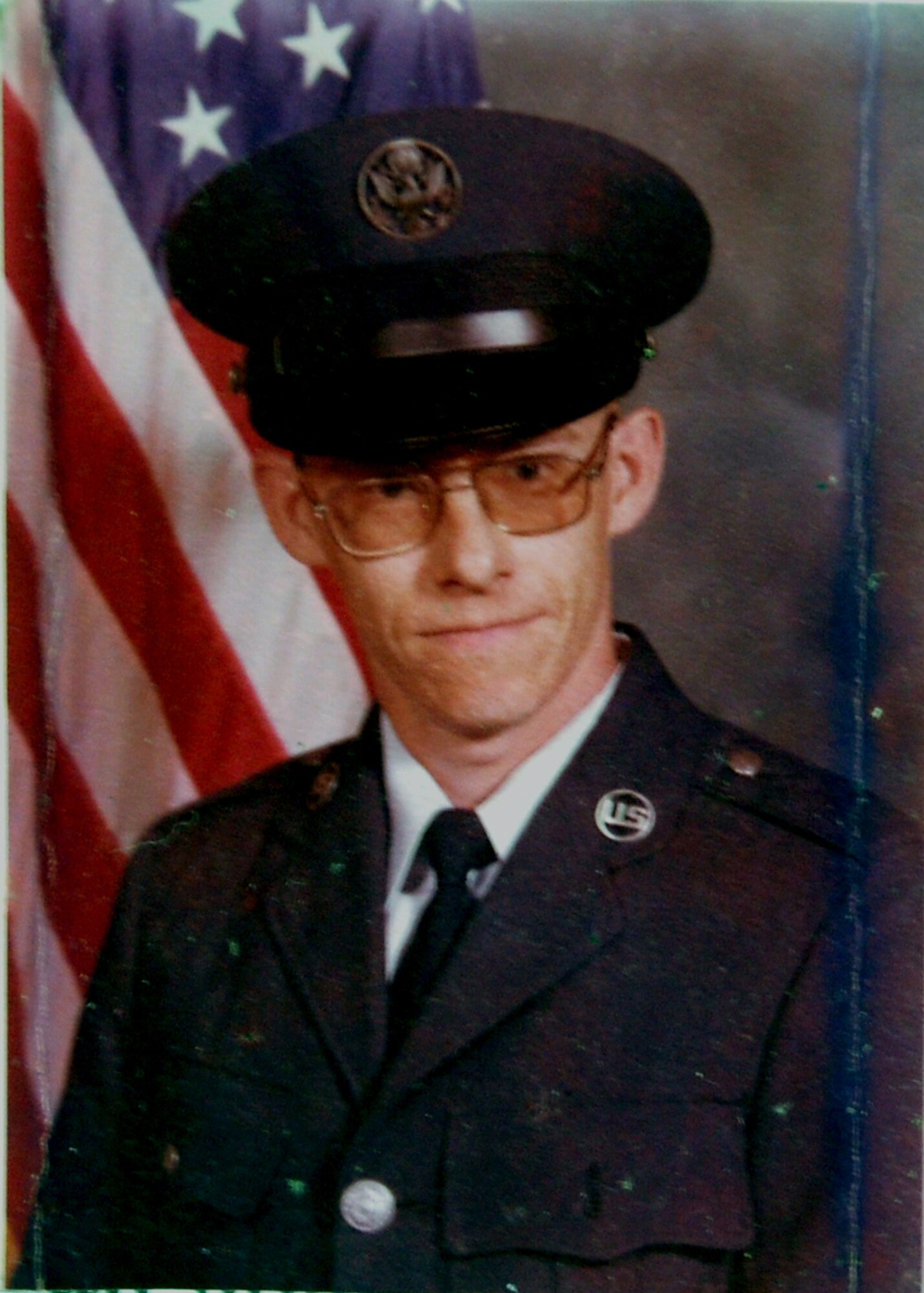 This is a photo of a photo showing then-Airman Basic Reynolds A. Kuntzman after he graduated from Air Force basic training in 1979.  His career spanned nearly 16 years when he died on June 9, 1995, as Tech. Sgt. Kuntzman, while assigned to the Air Mobility Warfare Center with the 421st Ground Combat Readiness Squadron.  After his death, the center's leadership created the Reynolds A. Kuntzman Duty performance award given annually to an Airman in the grades of E-1 through E-6 recognizing superior duty performance in support of the center's mission and community.  (Photo courtesy of the Kuntzman family)