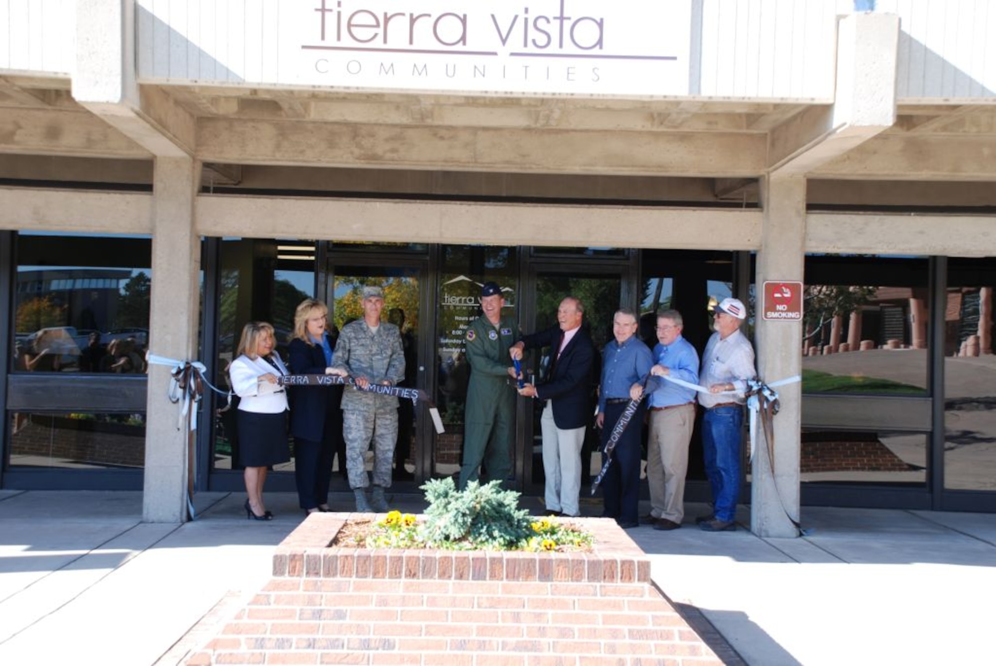 Col. Monteith, 21st Space Wing vice commander, and Jum Mullen, Tierra Vista Communities project director, cut a ribbon in a grand opening ceremony for the TVC office and community center on Peterson Sept. 25.  