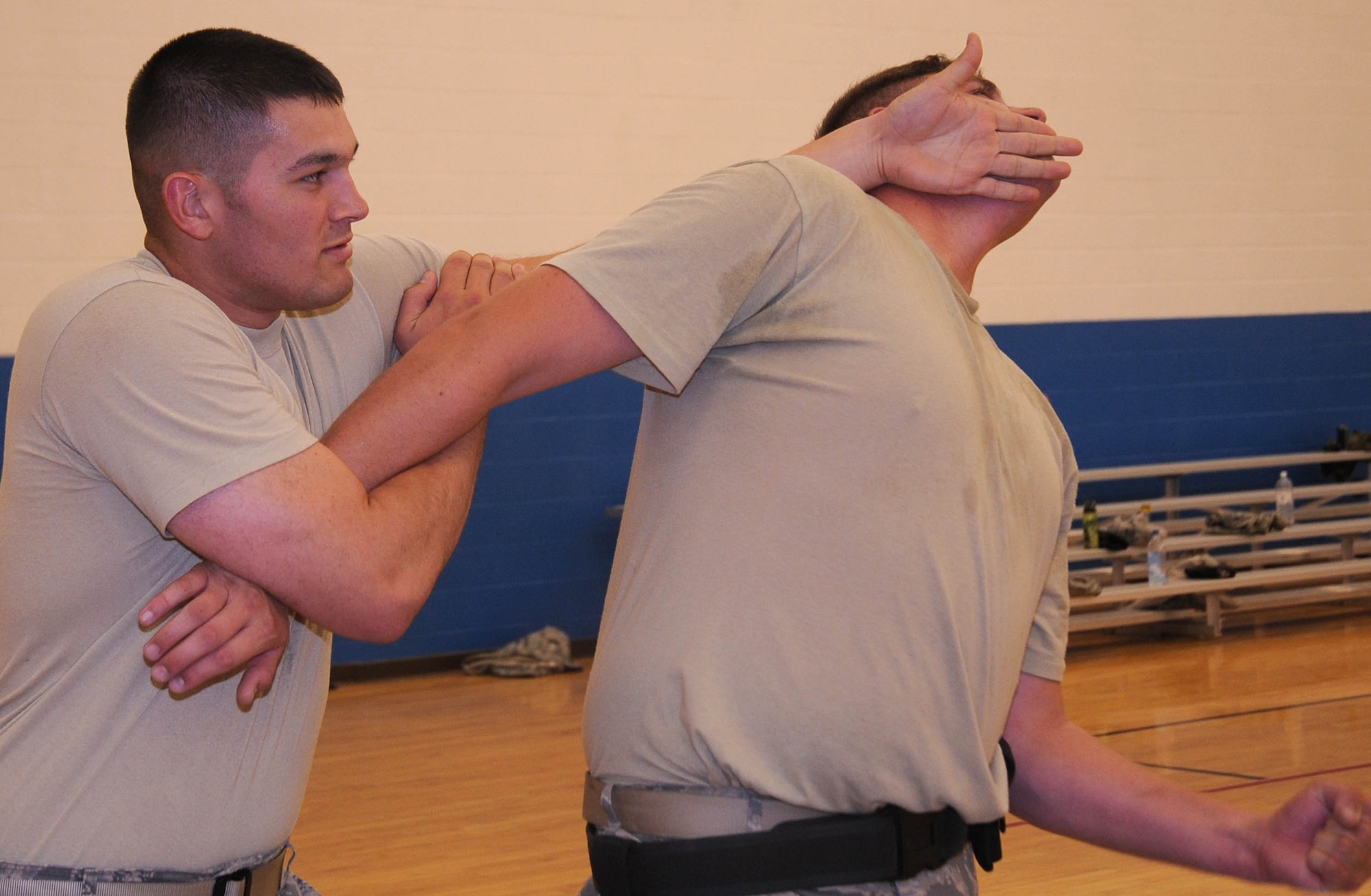 CANNON AIR FORCE BASE, N.M. -- 2nd Lt. Michael Wetlesen (left), 377th Security Forces Squadron, Kirtland AFB, N.M., and Staff Sgt. Charles East, 27th Special Operations Security Forces Squadron, practice take downs and control holds during  training Oct. 1. The training creates a simple and effective system of force response training that can be quickly elevated as the threat increases.  (U.S. Air Force photo/Senior Airman Liliana Moreno)