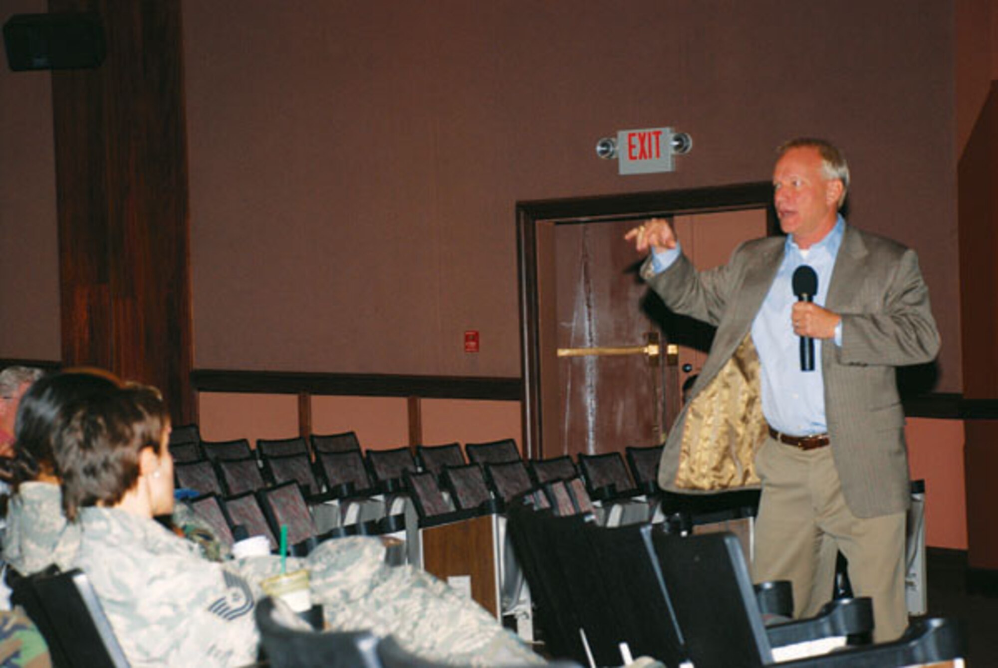 Motivational speaker Dr. Jeffery Zink speaks to Warren members at a large group session in the base theater Tuesday. Dr. Zink visited Warren Monday and Tuesday to share knowledge about ethics and leadership enrichment. (Photo by 2nd Lt. Brooke Brzozowske)