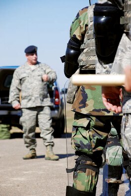 F.E. WARREN AIR FORCE BASE, Wyo. -- Col. David Martinez, 90th Security Forces Group commander, gets a chance to catch up with his troops Saturday at a Warren missile site. Members of Warren’s security forces came out to refresh their riot and crowd control training in preparation for potential protests at missile facilities. (Photo by 2nd Lt. Brooke Brzozowske) 