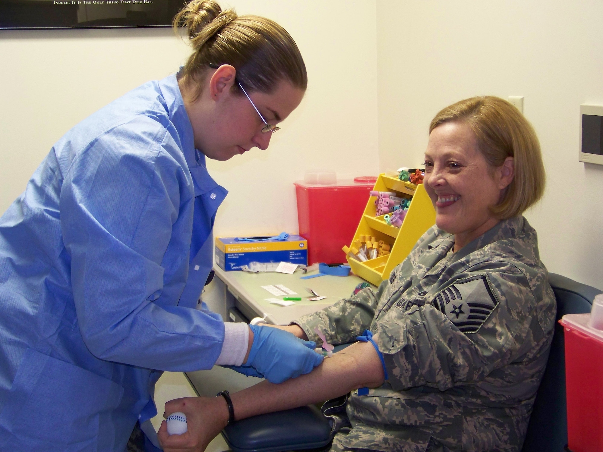 Staff Sgt. Amanda Spayde, 477th Aerospace Medicine Flight, draws blood from Master Sgt. Karen Oakes, 477th Maintenance Squadron, on September 6. The October Unit Training Assembly marked the first time the 477th Aerospace Medicine Flight performed medical procedures at the Elmendorf hospital. They will begin giving long and short physicals in November. (U.S Air Force Photo by Capt. Torri White)