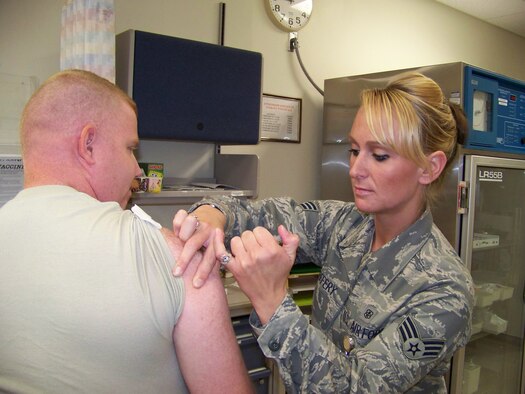 Senior Airman Sammy Jeffery, 477th Aerospace Medicine Flight, administers a shot to a 477th Fighter Group member on September 6. September marked the first Unit Training Assembly for the 477th Aerospace Medicine Flight to perform vaccinations. They will begin giving long and short physicals in November. When fully manned, the 477th Aerospace Medical Flight will be responsible for tracking the medical health of a combat-ready force of approximately 425 Air Reserve Technicians and Traditional Reservists to support the active duty and Expeditionary Air Force. (U.S Air Force Photo by Capt. Torri White)