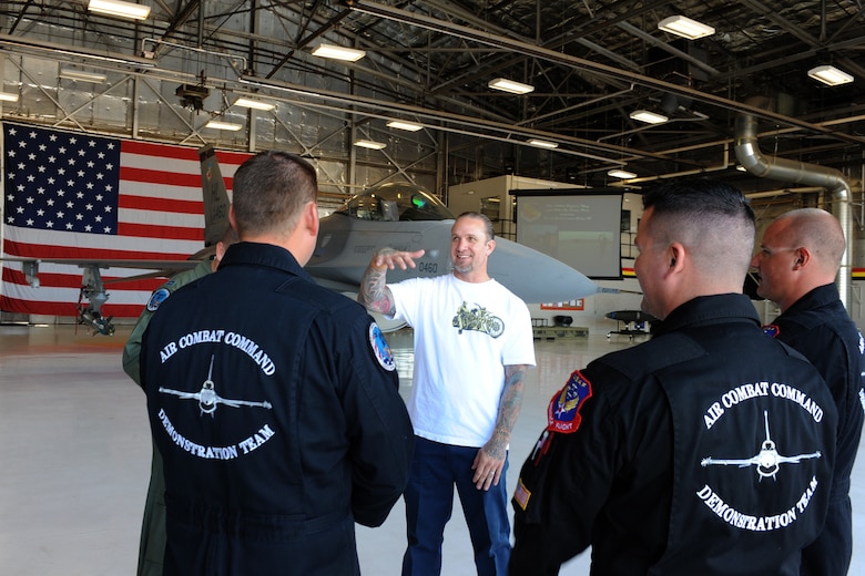 Jesse James (center) of the upcoming Spike TV series "Jesse James is a Dead Man" prepares for an orientation flight with the Viper West F-16 demonstration team Sep. 18. The flight aims to give Mr. James and his viewers a taste of the Fighting Falcon's capabilities and the Airmen who prepare it for combat. (U.S. Air Force photo by James Arrowood) 