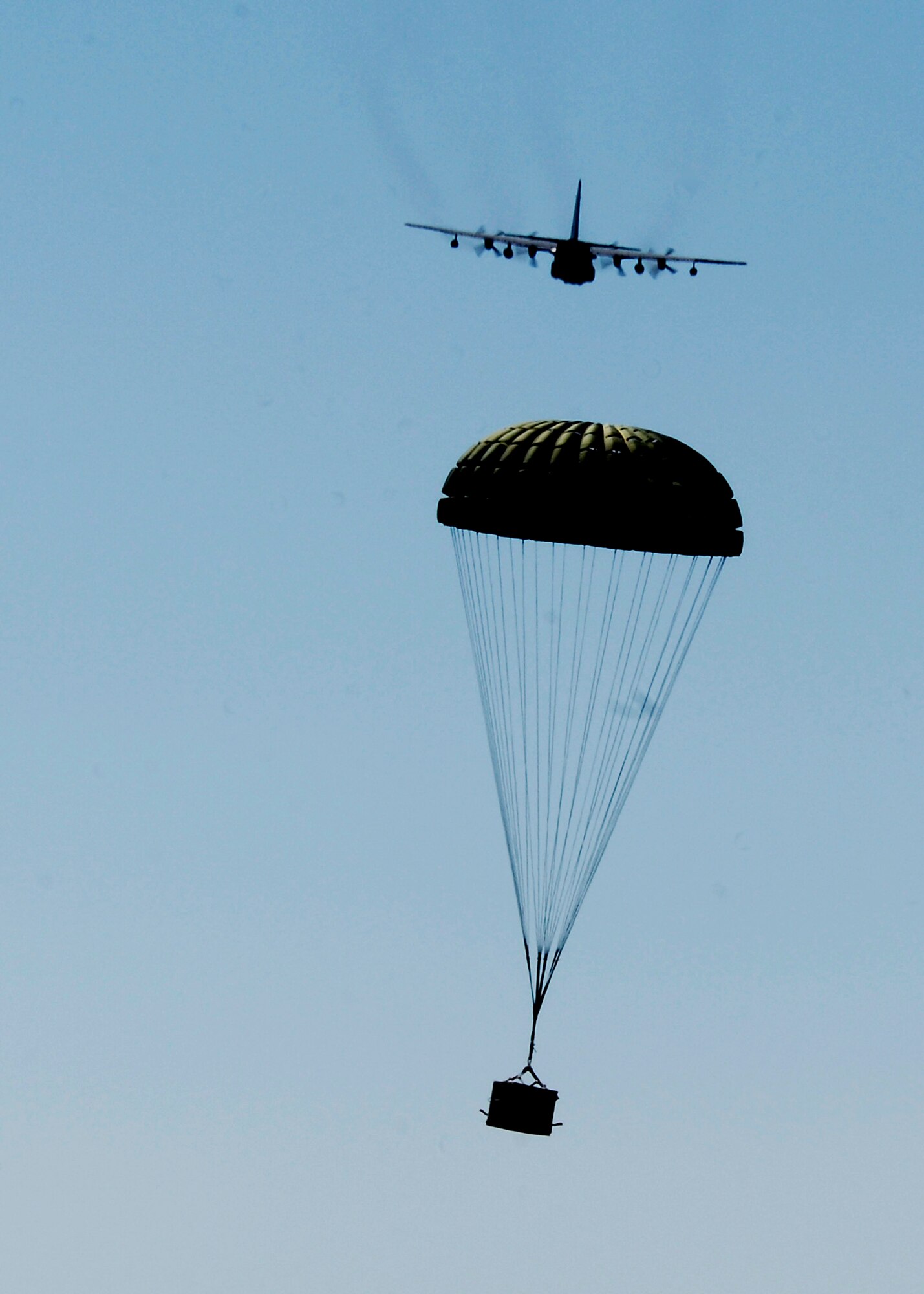 CANNON AIR FORCE BASE, N.M.-- An MC-130W Combat Spear drops a Container Release System load at Melrose Air Force Range during a training exercise Sept. 23. The drops are done at least once a week and prepares the aircrews for resupply missions in areas that have no airfields. (U.S. Air Force photo/Airman 1st Class Evelyn Chavez) 