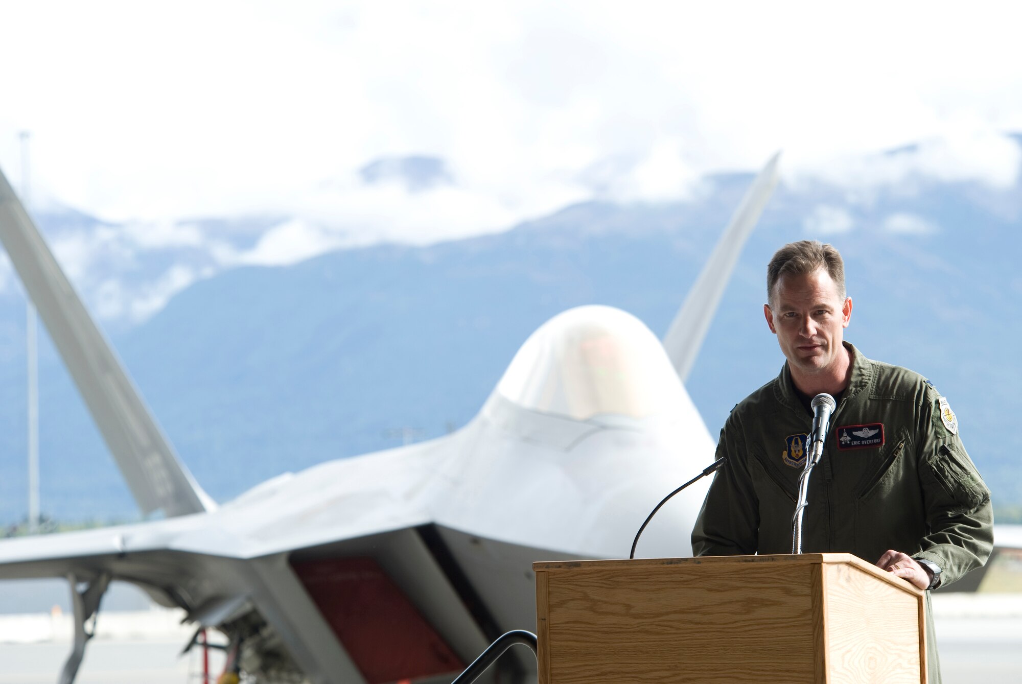 Col. Eric Overturf, 477th Fighter Group Commander, speaks during the Elmendorf AFB, Alaska Initial Operational Capability ceremony September 5. The IOC celebration was and a Total Force celebration held to recognize the first attainment of the capability to employ effectively a weapon, item of equipment, or system of approved specific characteristics that is manned or operated by an adequately trained, equipped and supported military unit. (U.S Air Force Photo by Senior Airman Matt Owens)