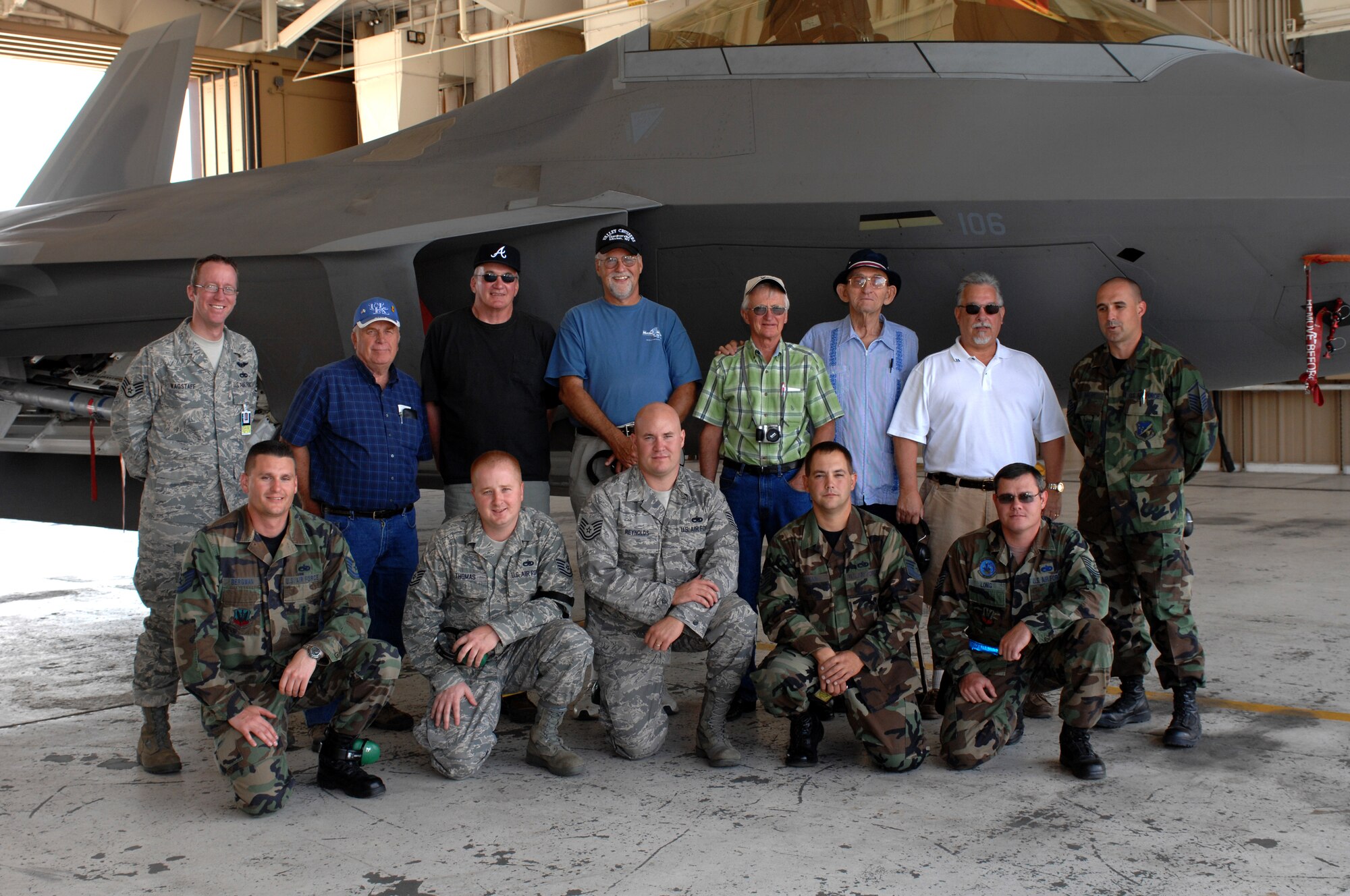 Six former crew chiefs from the 8th Fighter Squadron pose for a photograph in front of the F-22A Raptor with members from the 49th Aircraft Maintenance Squadron at Holloman Air Force Base, N.M., September 26. The veterans all worked together in 1968 when the 8 FS was relocated from Spangdahlem Air Base, Germany, to Holloman, and were visiting as part of its 40 year reunion. (U.S. Air Force photo/Airman Sondra M. Escutia)