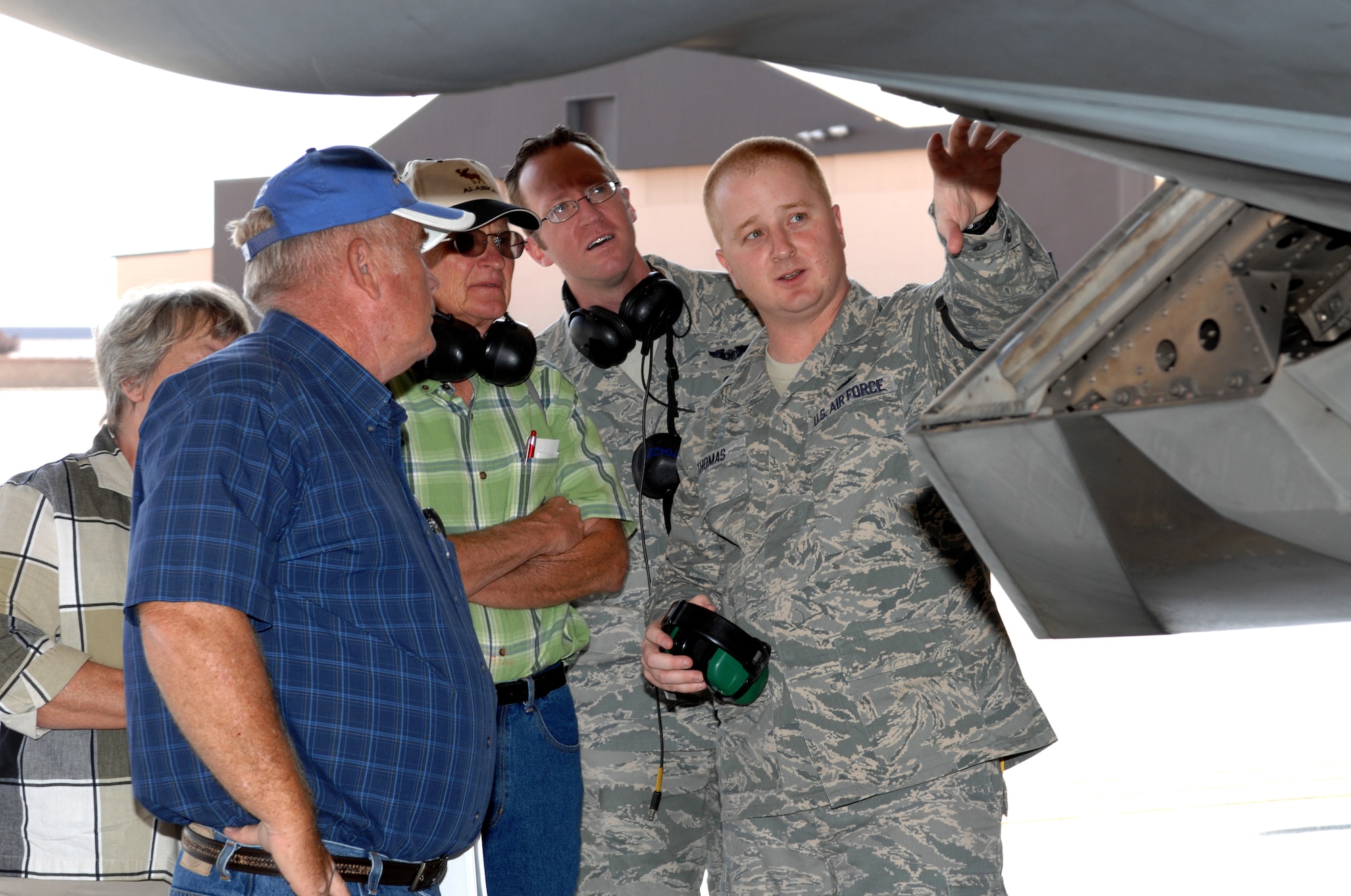 Tech. Sgt. Dennis Thomas, 49th Aircraft Maintenance Squadron, explains features of the F-22A Raptor to former crew chiefs with the 8th Fighter Squadron at Holloman Air Force Base, N.M., September 26. The six veterans and their family were touring Holloman in commemoration of their 40th reunion. (U.S. Air Force photo/Airman Sondra M. Escutia)