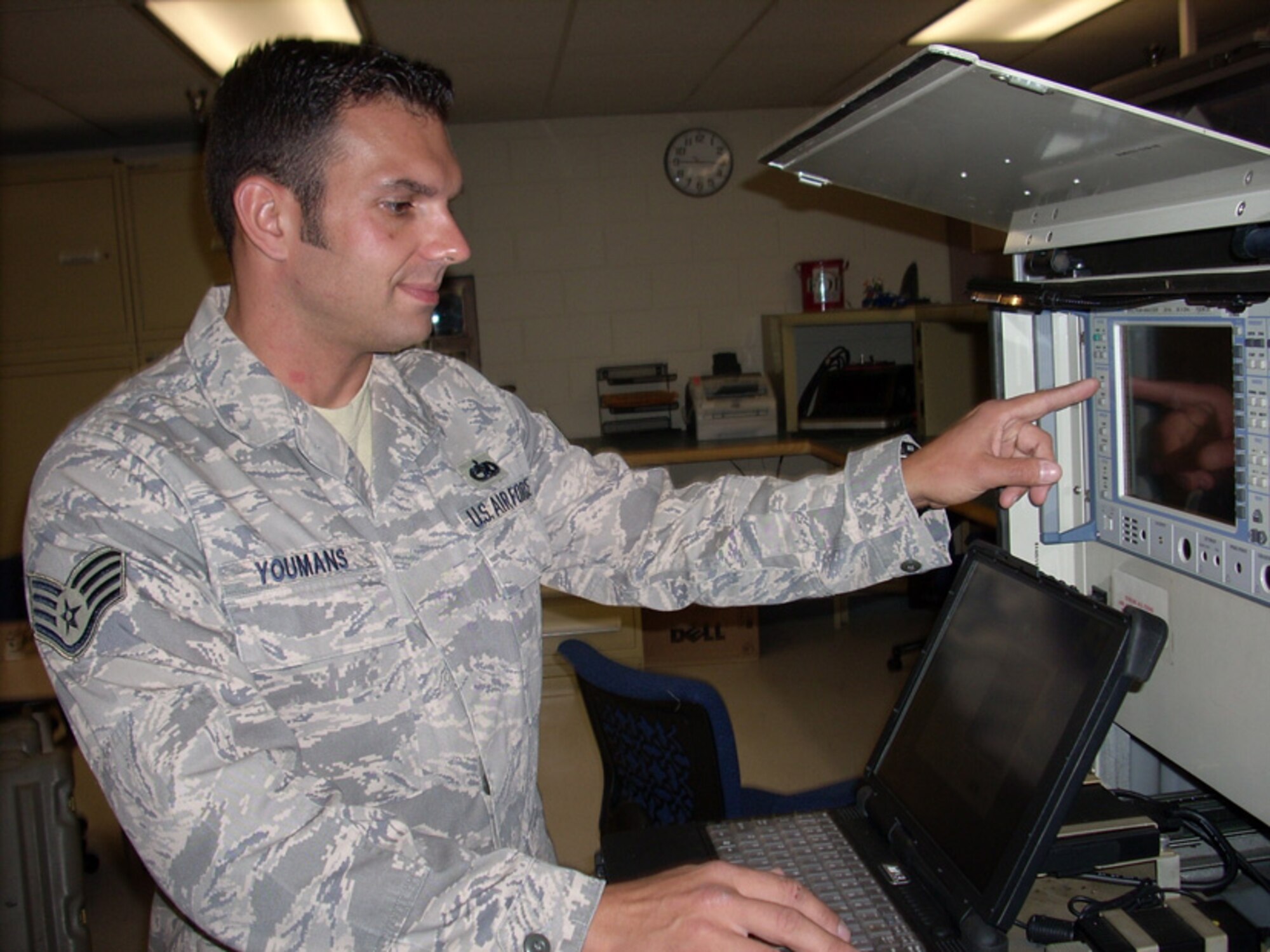 Staff Sgt. Ed Youmans, 16th Electronic Warfare Squadron, demonstrates a procedure on the USM 642 "Raven" signal generator - a machine that simulates any real world radar emitter and allows the Combat Shield team to assess aircraft's response to those signals.  The Combat Shield unit is tasked with testing the air defense systems of all A-10s, F-15s, F-16s, HH-60s and C-130s in the Air Force inventory.  U.S. Air Force photo.