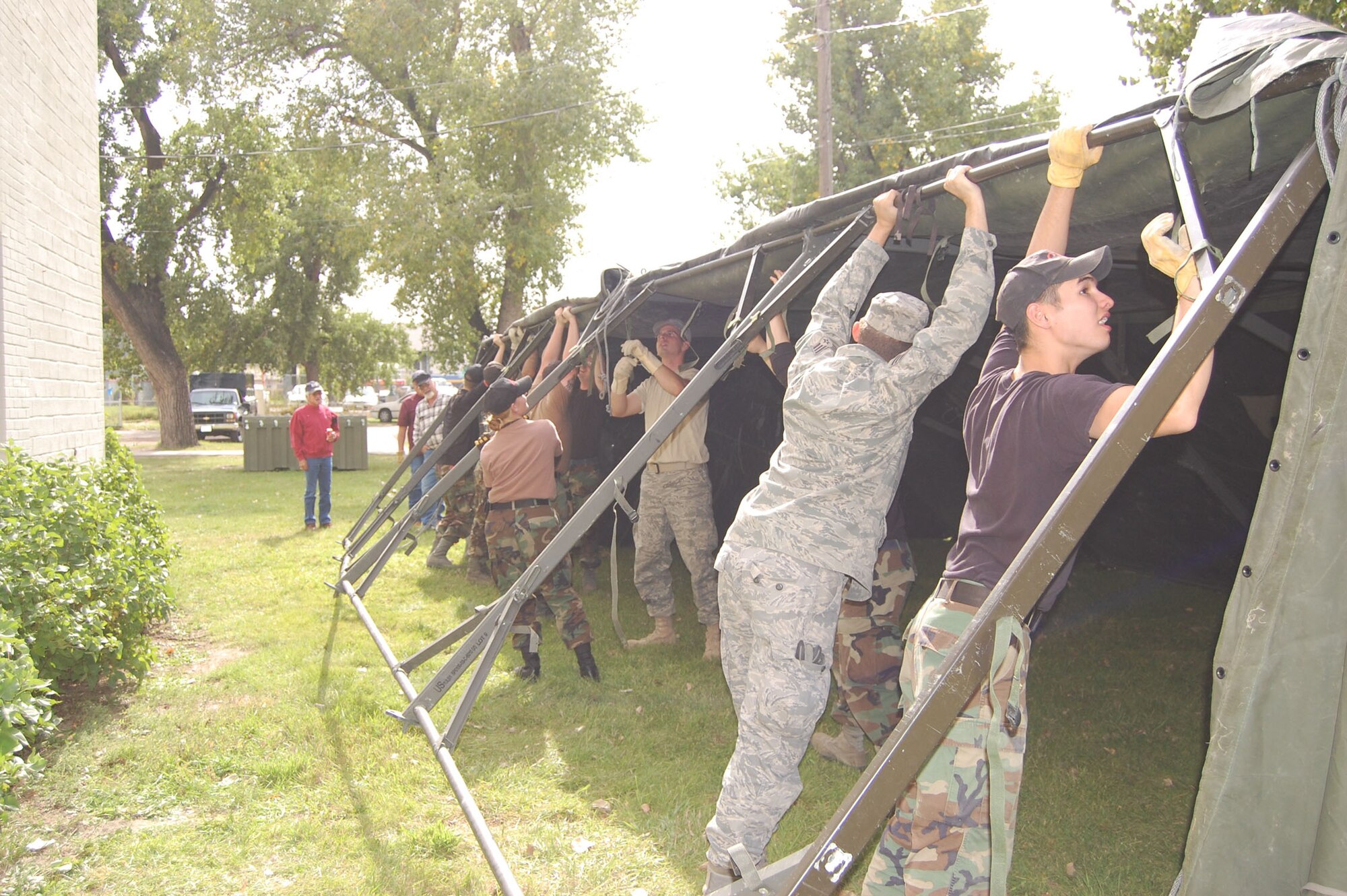 About a dozen members of the 341st Civil Engineer Squadron volunteered their time and effort to assemble military tents at the Great Falls Fair Grounds Sept. 25.  The tents and volunteers came from Malmstrom Air Force Base to support the second annual “Stand Down,” an event geared toward helping homeless veterans receive free medical check-ups, military clothing and supplies, and a free meal.    (U.S. Air Force photo/Senior Airman Eydie Sakura)