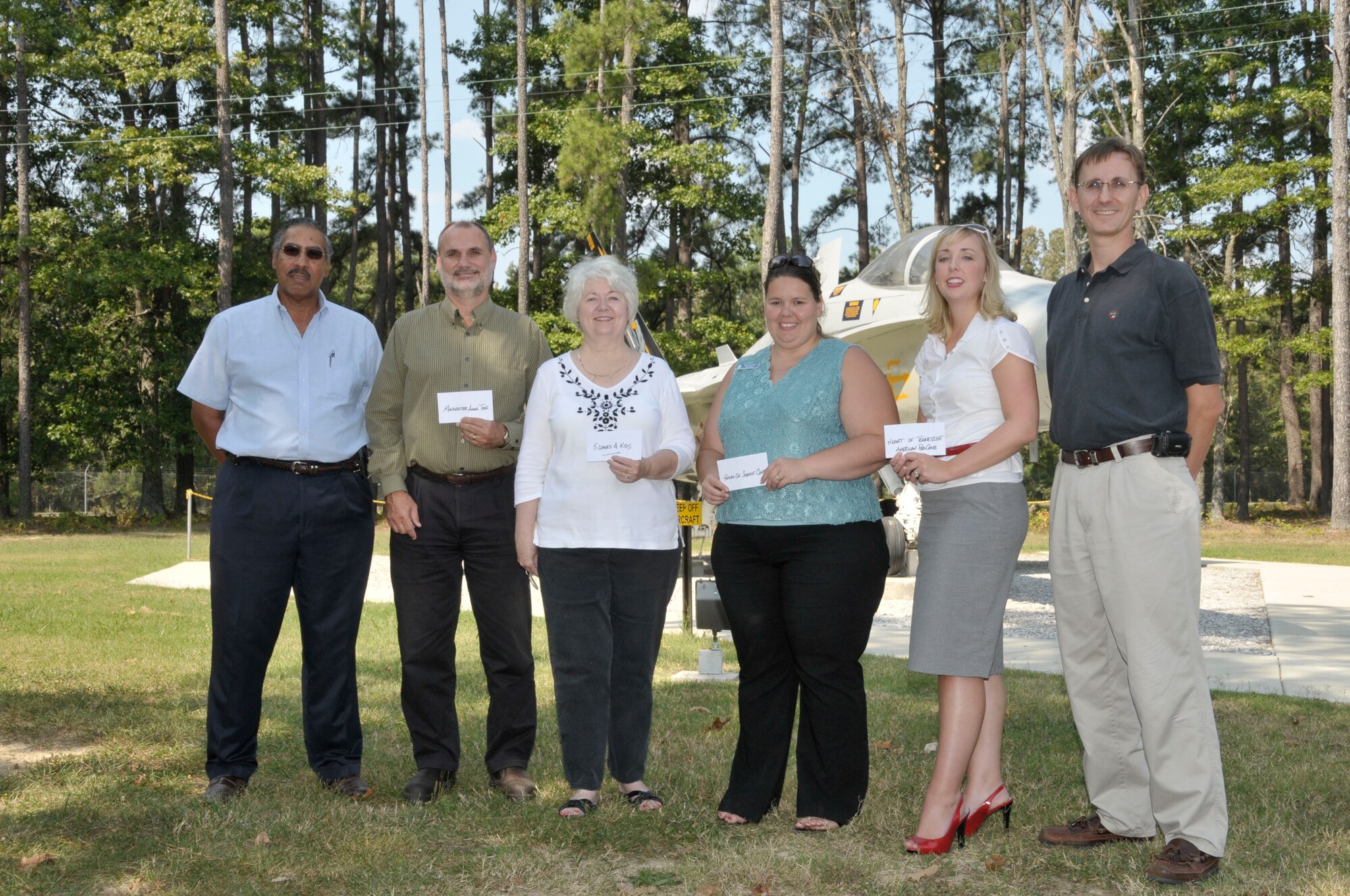 Pictured are the four organizations chosen for donations  from left to right Fred Battles, Aerospace Testing Alliance (ATA) Golf Committee; Greg Holcomb, Manchester Angel Tree; Jeannie Williams, 5 Loaves 4 Kids, Misty Marshall, Hands on Science Center; Beth Ferguson, Heart of Tennessee Chapter of the American Red Cross and Greg Sandlin, ATA Golf Committee. (Photo by Rick Goodfriend)