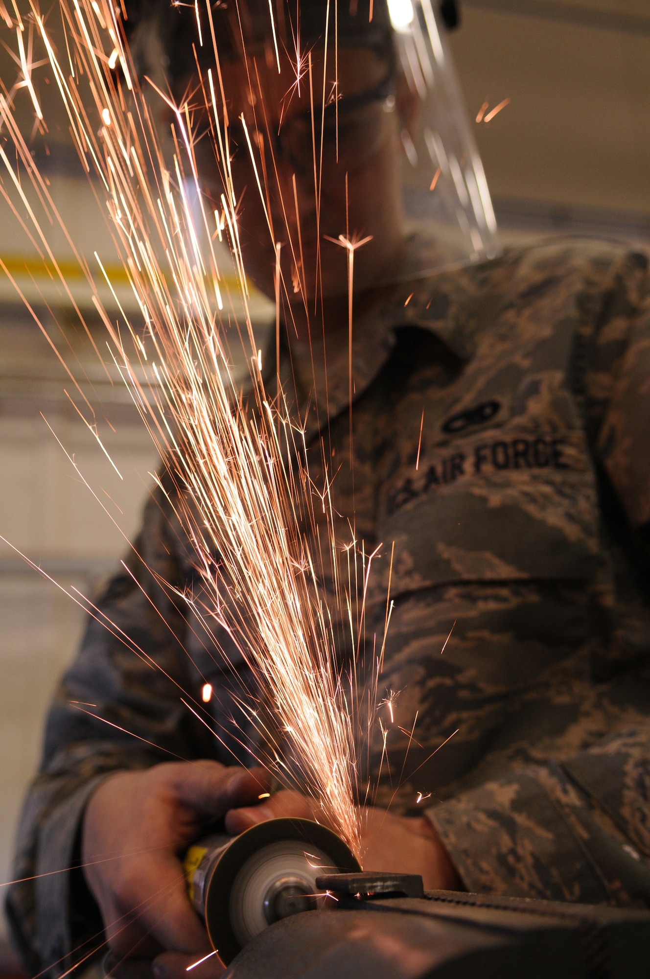 Airman 1st Class Travis Roland, an aircraft structural apprentice from the 100th Maintenance Squadron, fabricates two “L” brackets for a KC-135 Oct. 1, 2008, at RAF Mildenhall, England. Airman Roland’s duties are vast from simple nut plate replacements to complicated aircraft structural repairs and the art of bending, forming, cutting, and shaping of sheet metal to specific shapes and sizes. (U.S. Air Force photo by Staff Sgt. Jerry Fleshman)