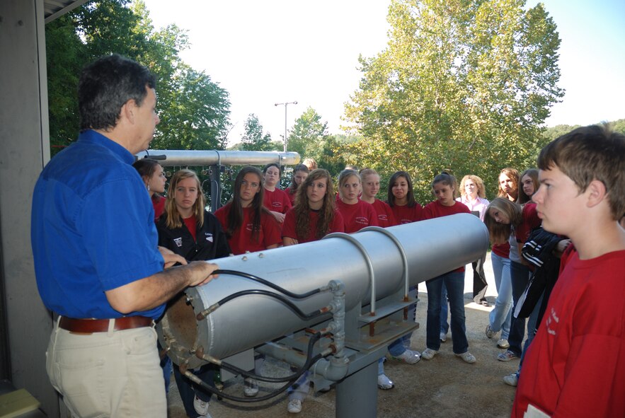 Peter Sherrhouse, research associate, explains how to use rocket exhaust to generate electricity in flight at UTSI. (Photo by Tony Saad)