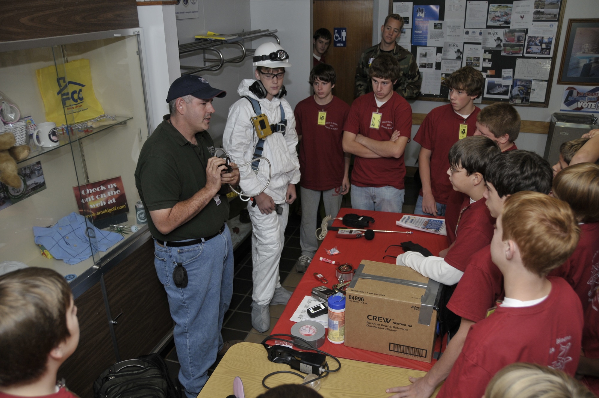 Billy Sizemore suits up a student in Tyvek gear to demonstrate precautionary measures before going into an industrial work place. (Photo by Rick Goodfriend)