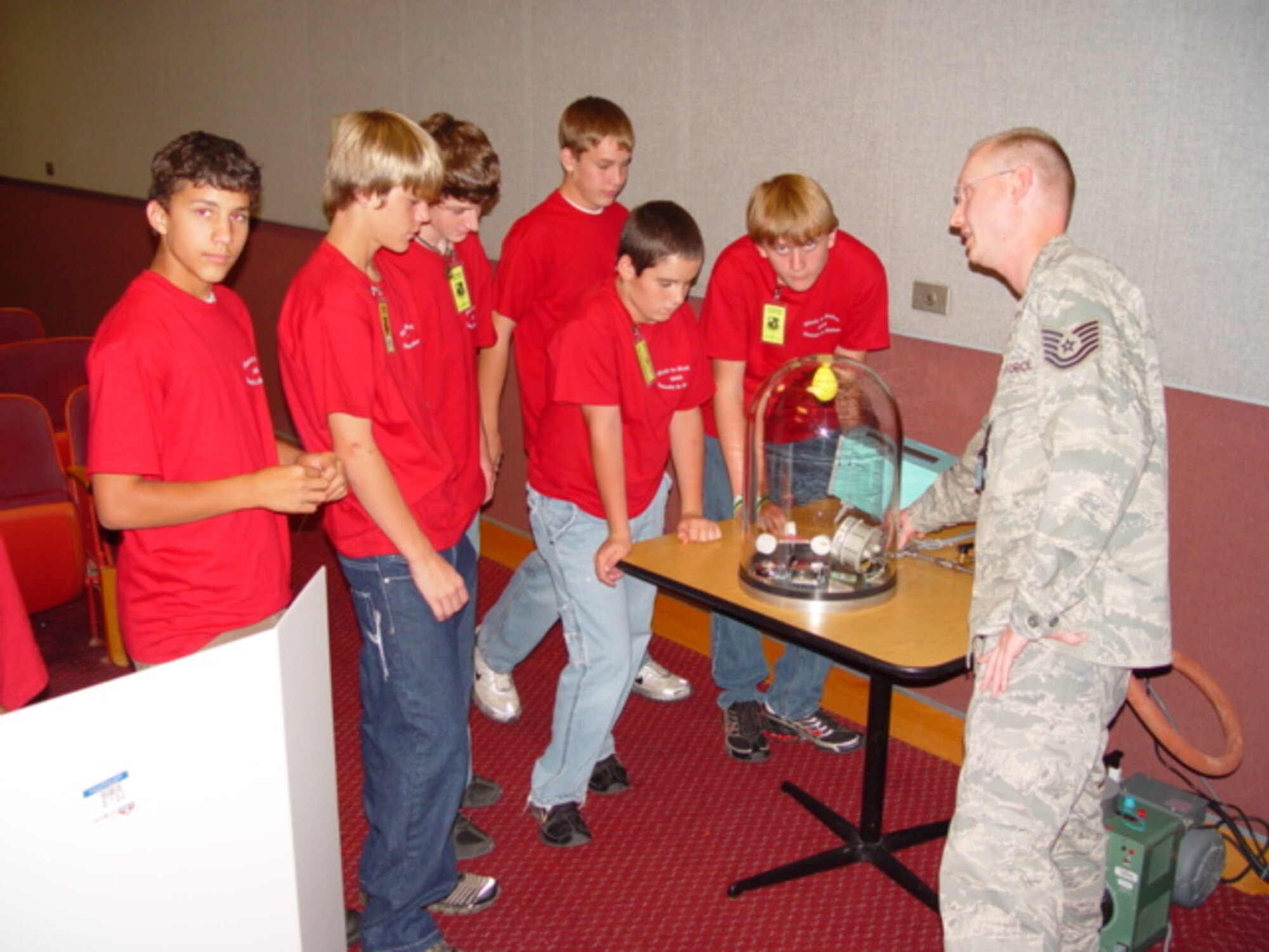 Tech. Sgt. Jamie Johnson, Non-Commissioned Officer-in-Charge of PMEL, demonstrates how a small vacuum chamber works. (Photo by Joel Fortner)