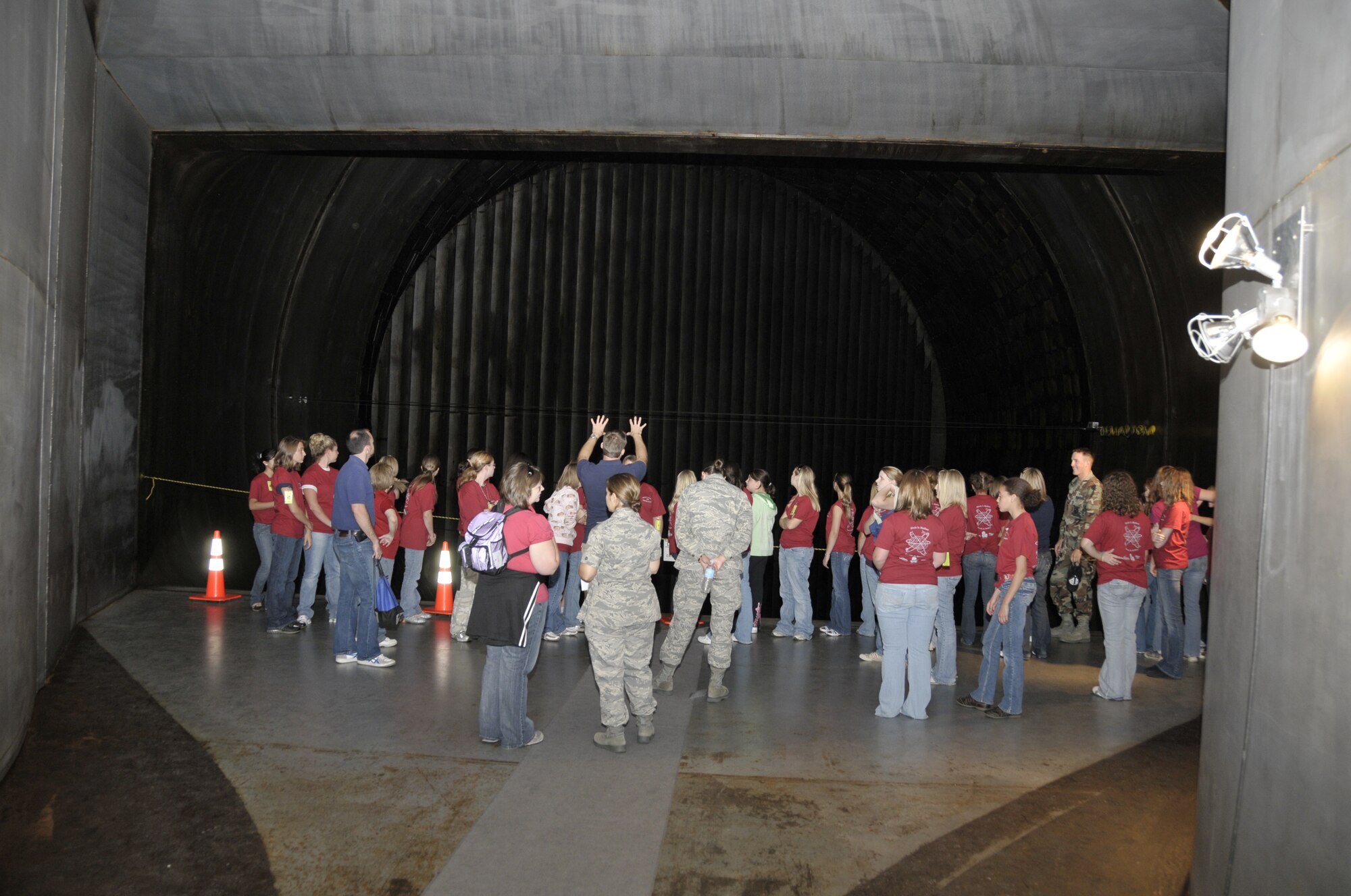 Dr. Rich Roberts explains to a group of eighth graders how the 16-foot supersonic wind tunnel would work during a test. (Photo by Rick Goodfriend)